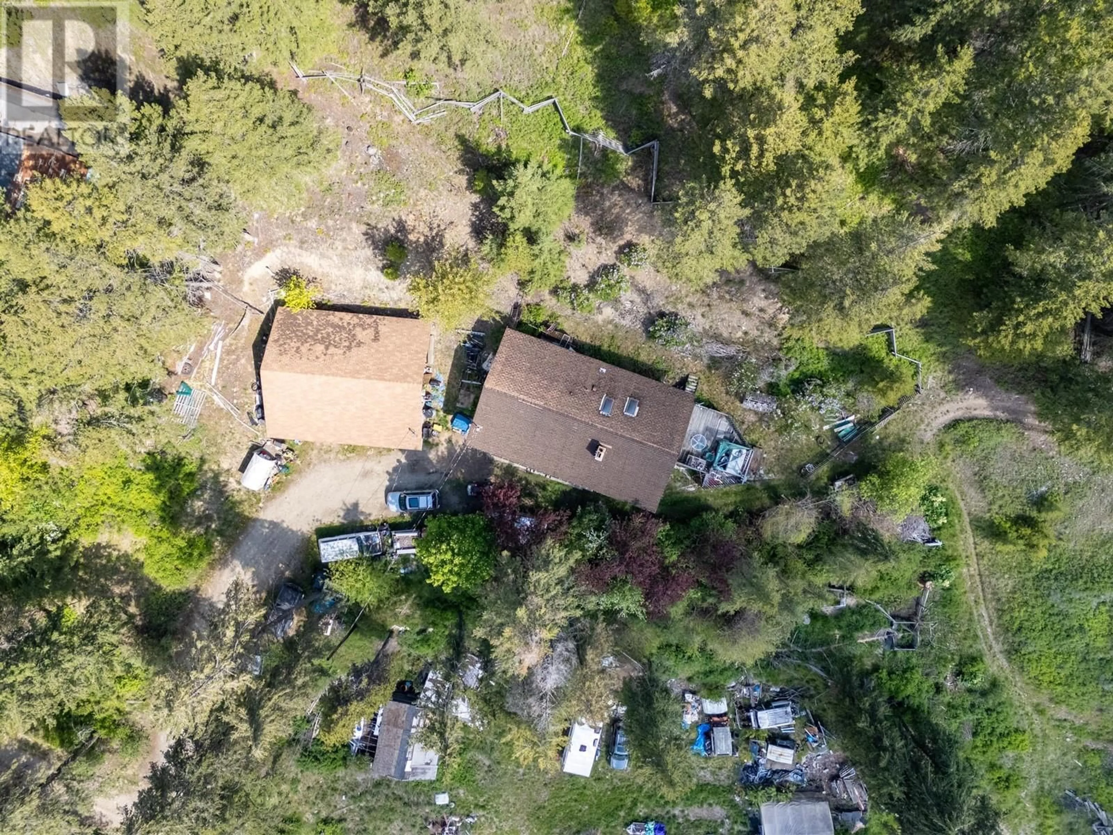A pic from outside/outdoor area/front of a property/back of a property/a pic from drone, forest/trees view for 9050 HIGHWAY 33 HIGHWAY, Kelowna British Columbia V1P1J4