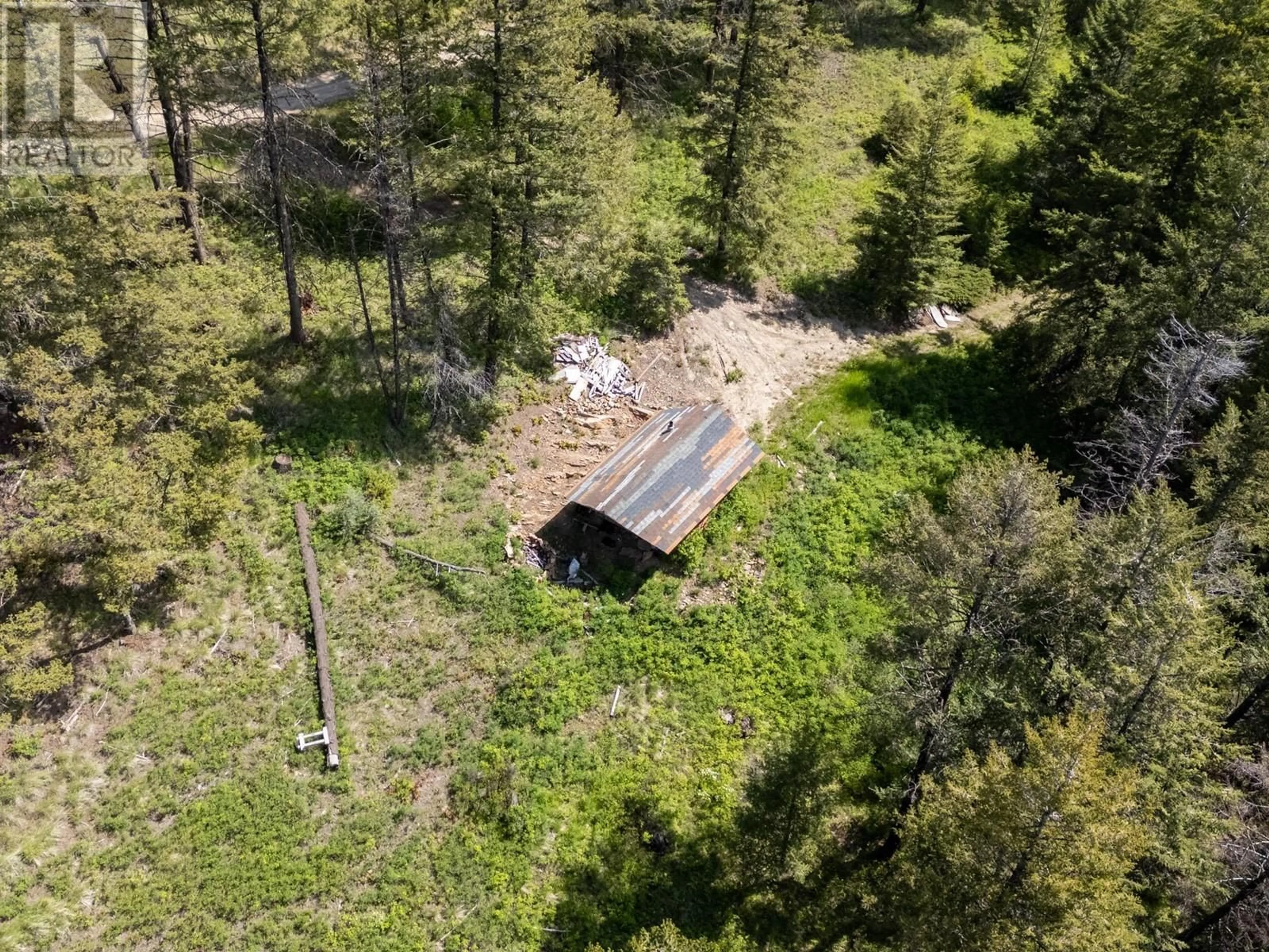 A pic from outside/outdoor area/front of a property/back of a property/a pic from drone, forest/trees view for 9050 HIGHWAY 33 HIGHWAY, Kelowna British Columbia V1P1J4
