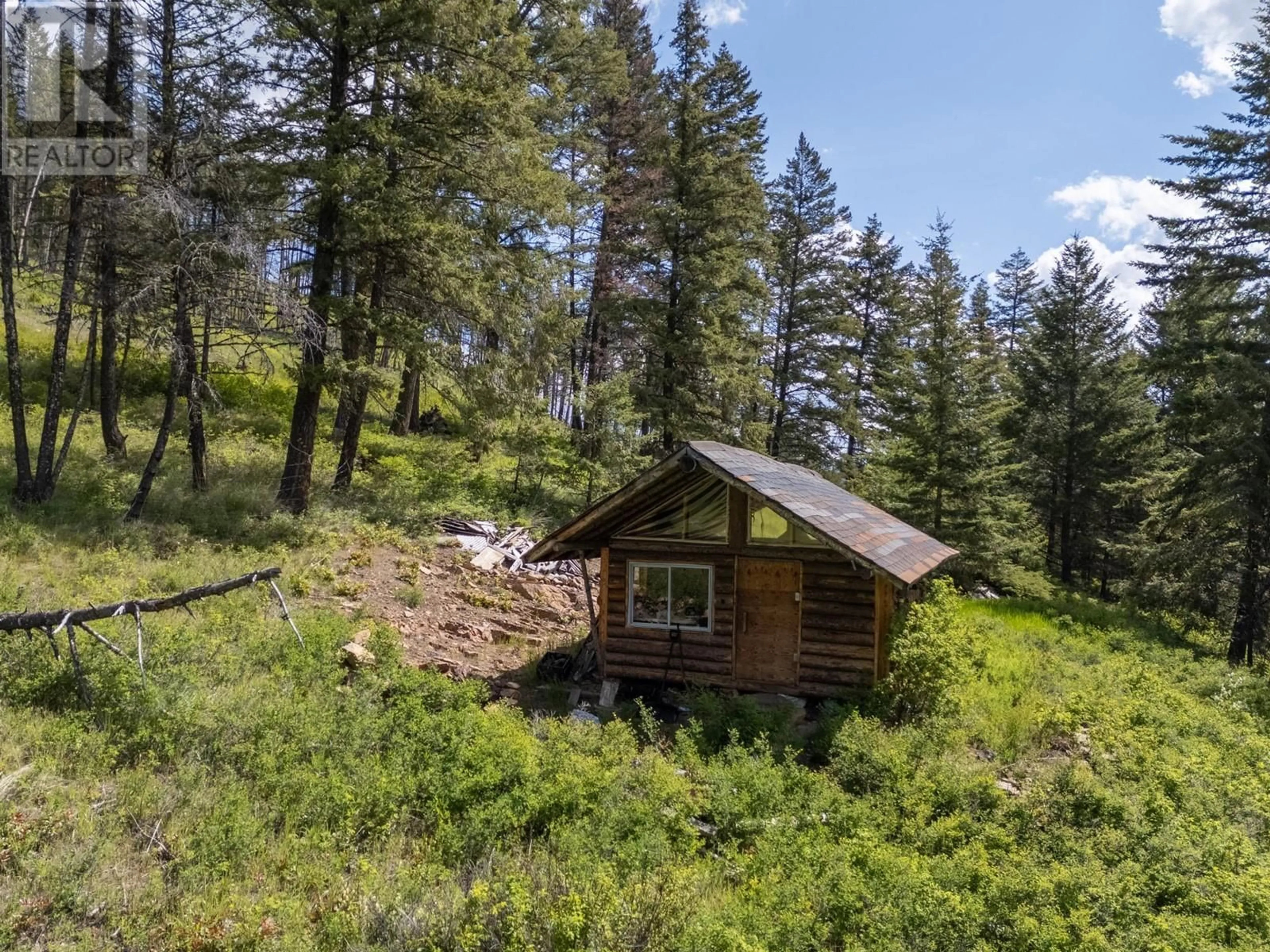 A pic from outside/outdoor area/front of a property/back of a property/a pic from drone, forest/trees view for 9050 HIGHWAY 33 HIGHWAY, Kelowna British Columbia V1P1J4