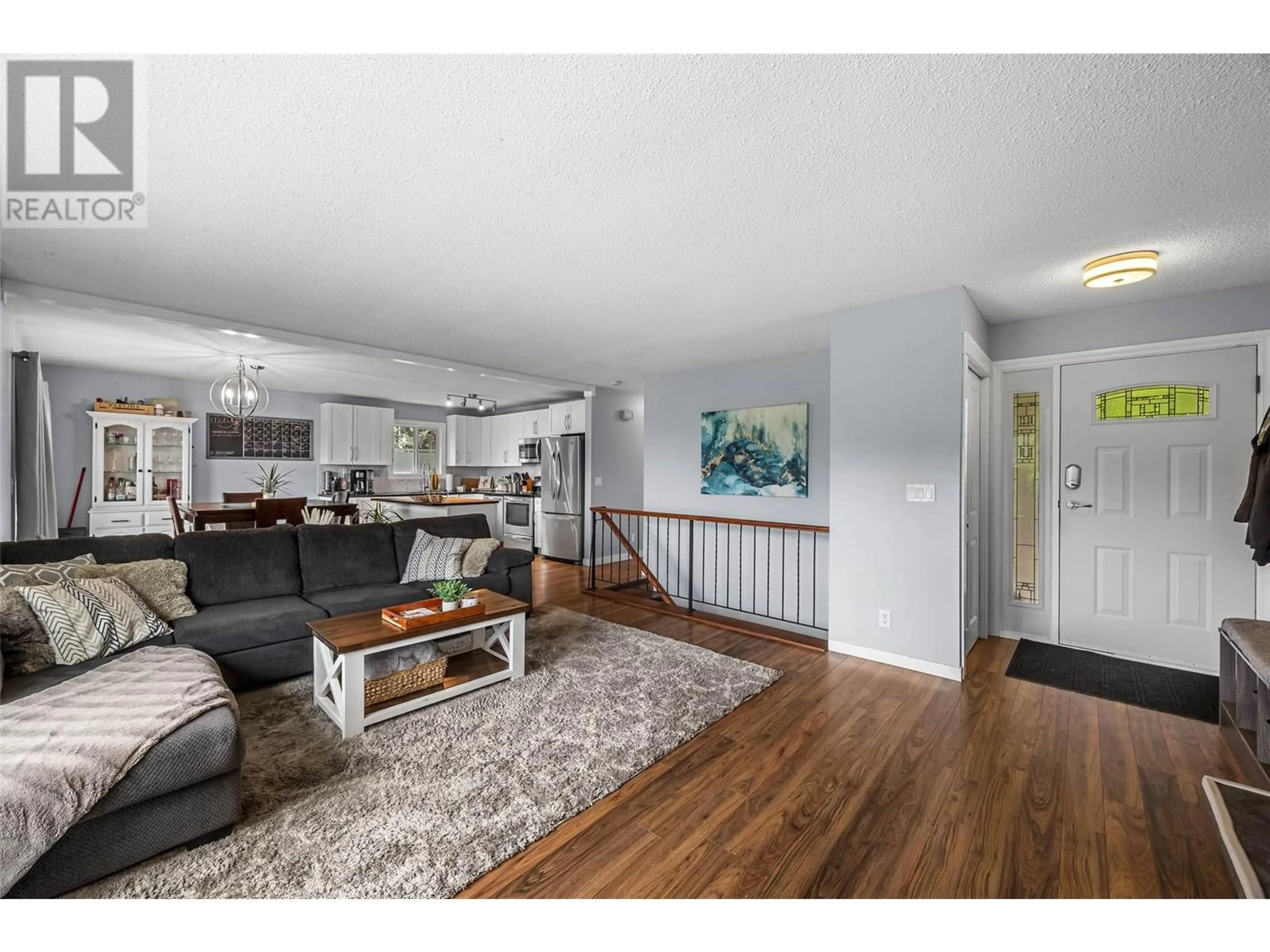 Living room with furniture, wood/laminate floor for 1249 MONASHEE COURT, Kamloops British Columbia V2C6B4