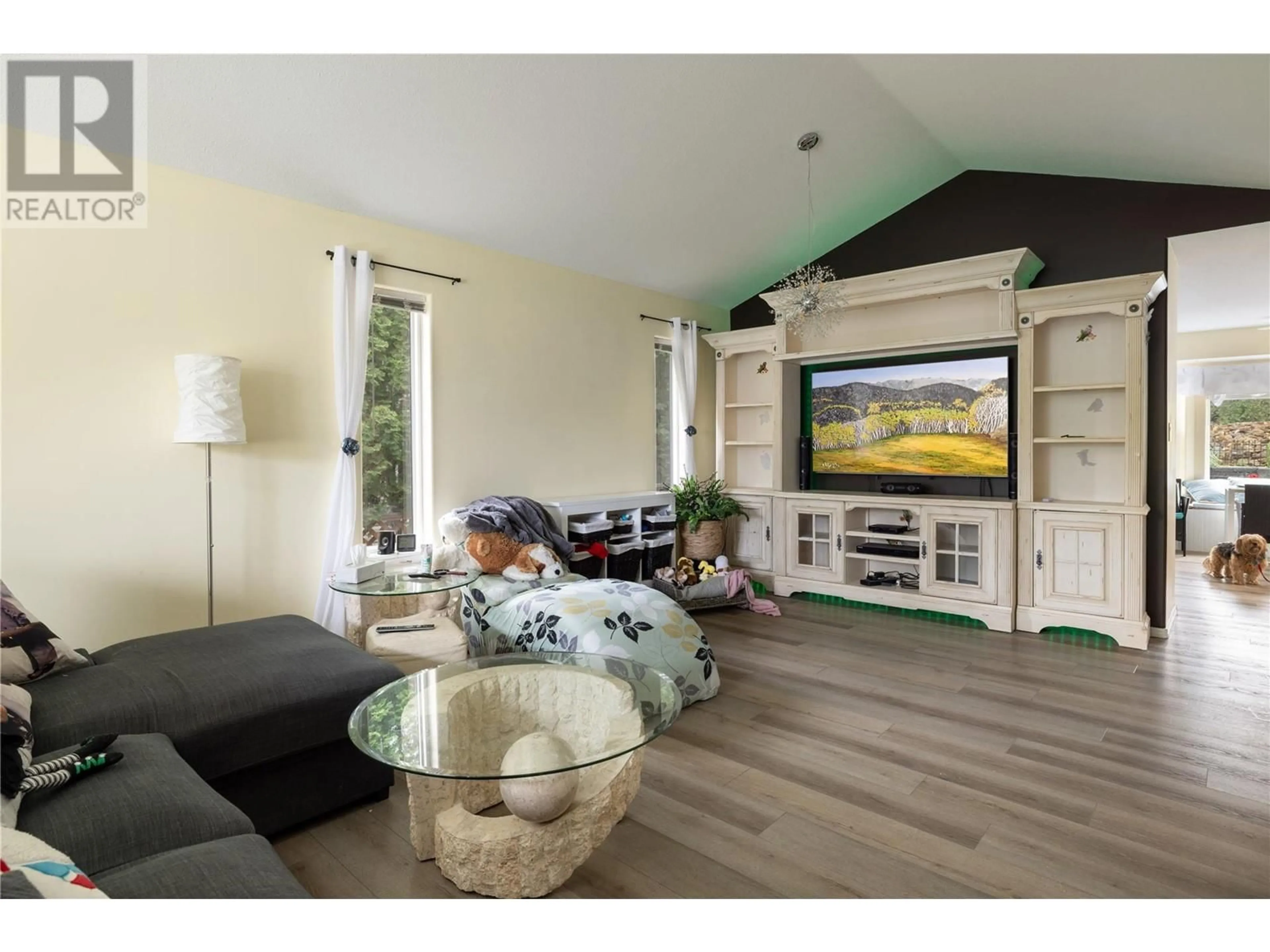 Living room with furniture, wood/laminate floor for 653 6TH STREET, Vernon British Columbia V1H1Z1