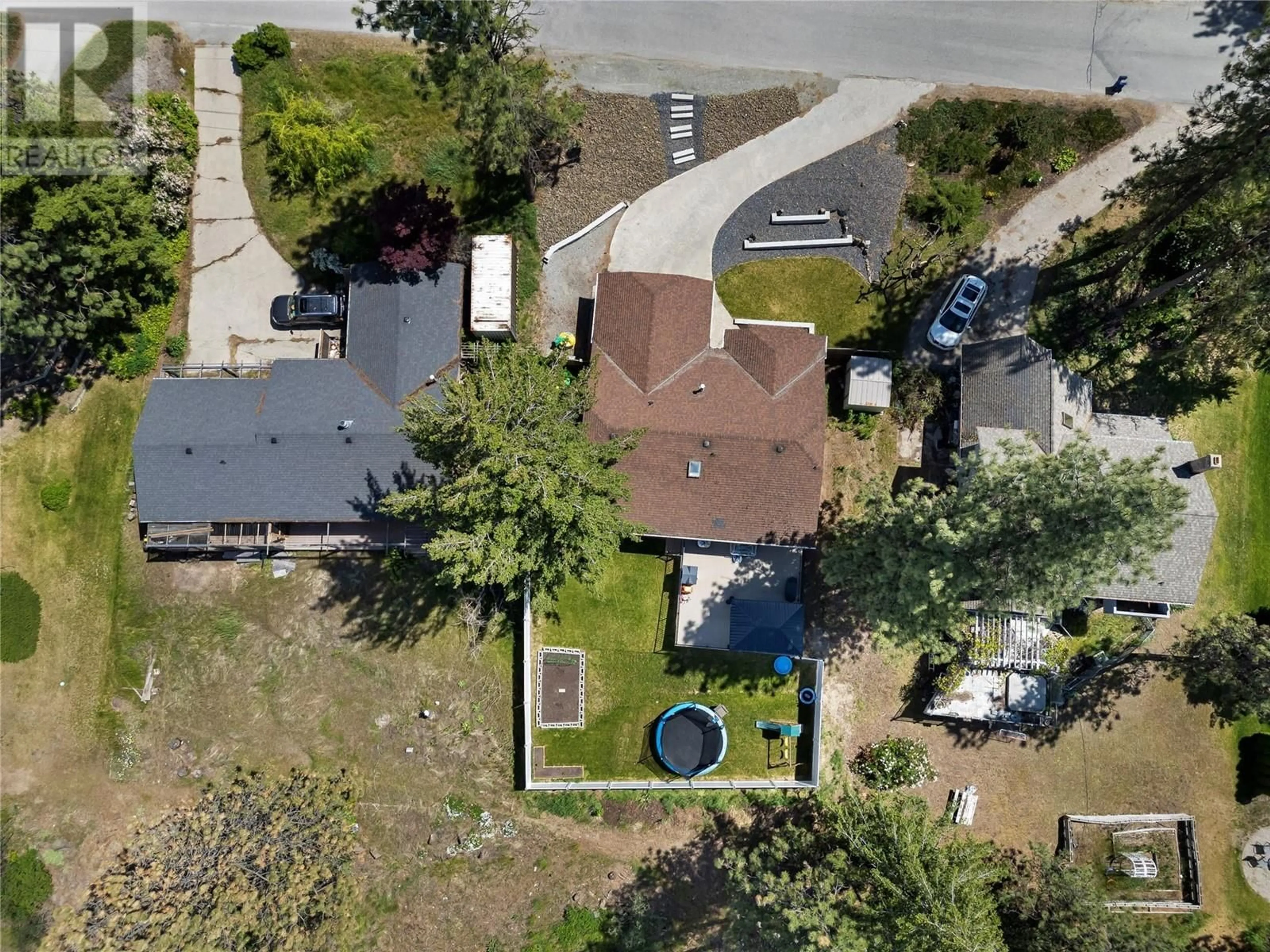 A pic from outside/outdoor area/front of a property/back of a property/a pic from drone, street for 2036 TOMAT AVENUE, West Kelowna British Columbia V1Z3C5