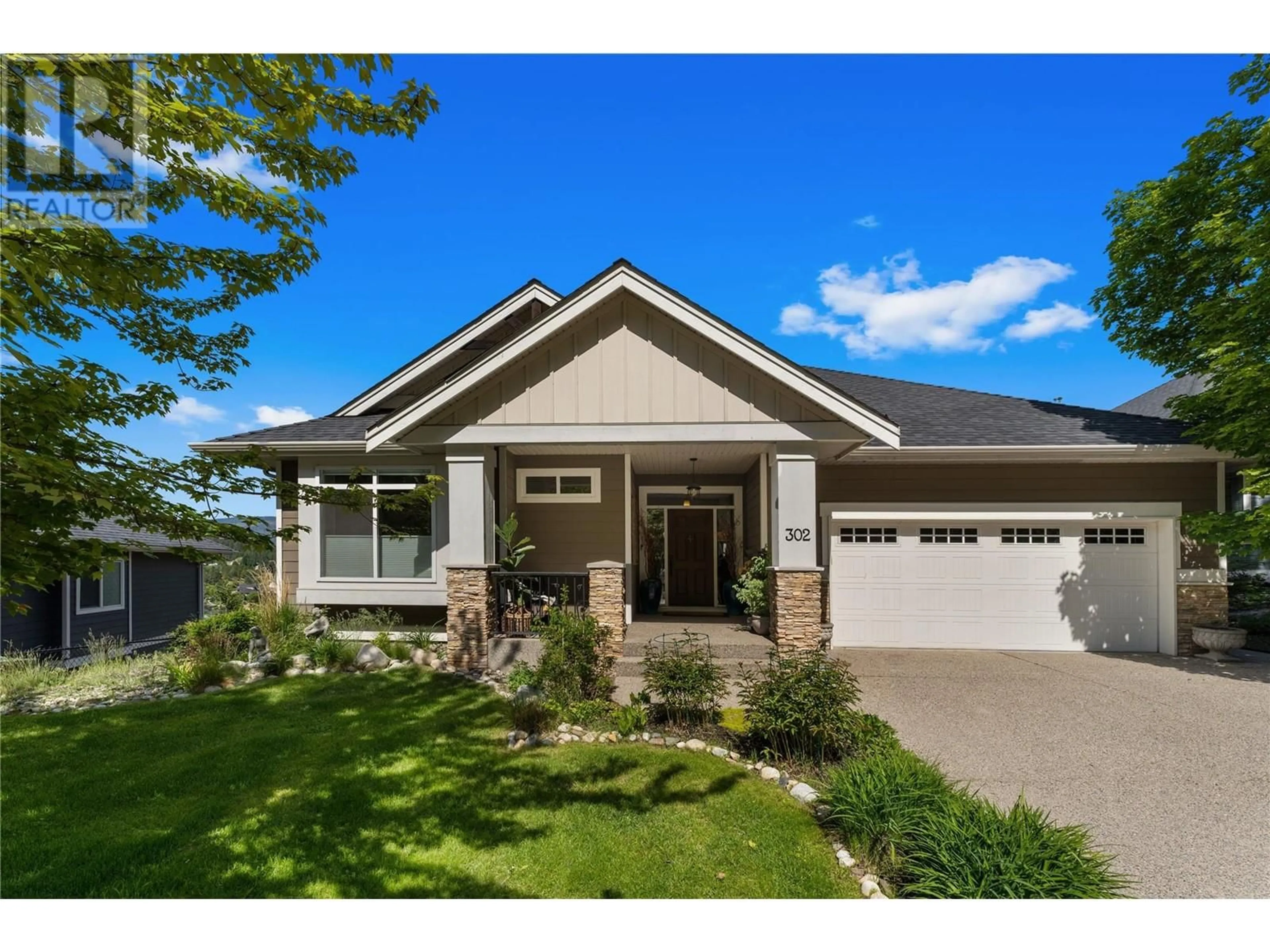 Home with vinyl exterior material, street for 302 UPPER CANYON DRIVE, Kelowna British Columbia V1V2Z8