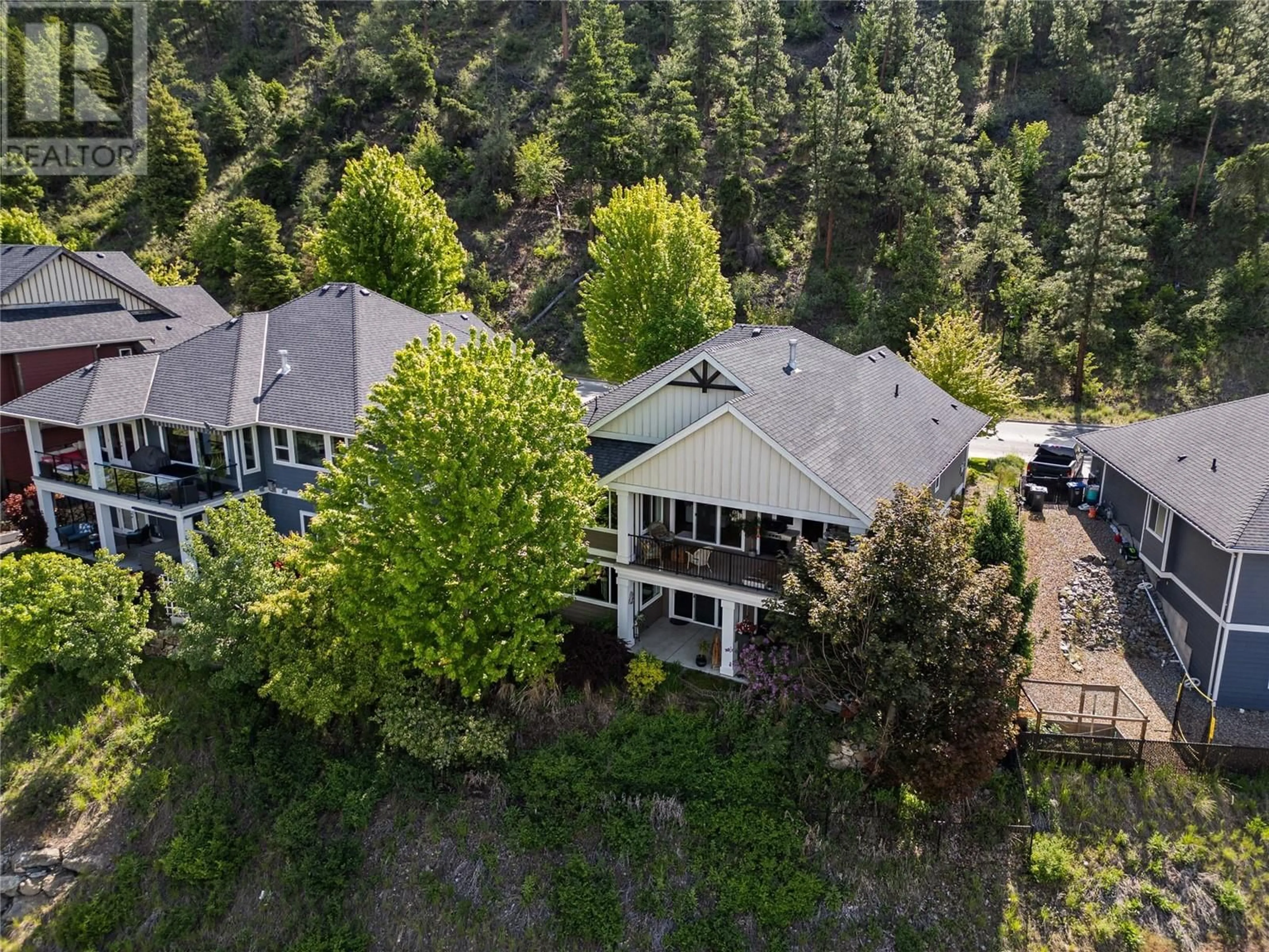 A pic from outside/outdoor area/front of a property/back of a property/a pic from drone, forest/trees view for 302 UPPER CANYON DRIVE, Kelowna British Columbia V1V2Z8