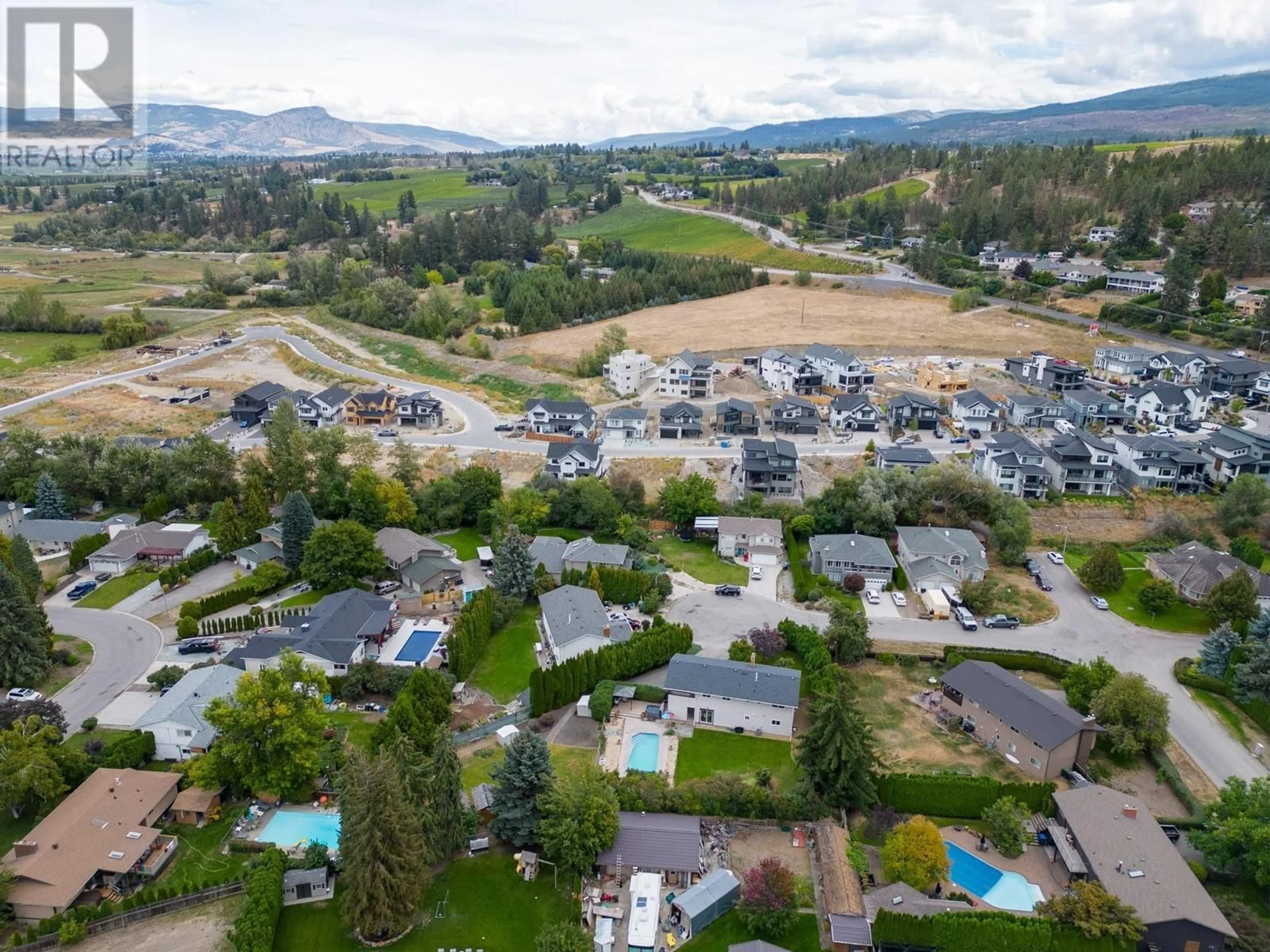A pic from outside/outdoor area/front of a property/back of a property/a pic from drone, mountain view for 790 TORRS COURT, Kelowna British Columbia V1W1B5