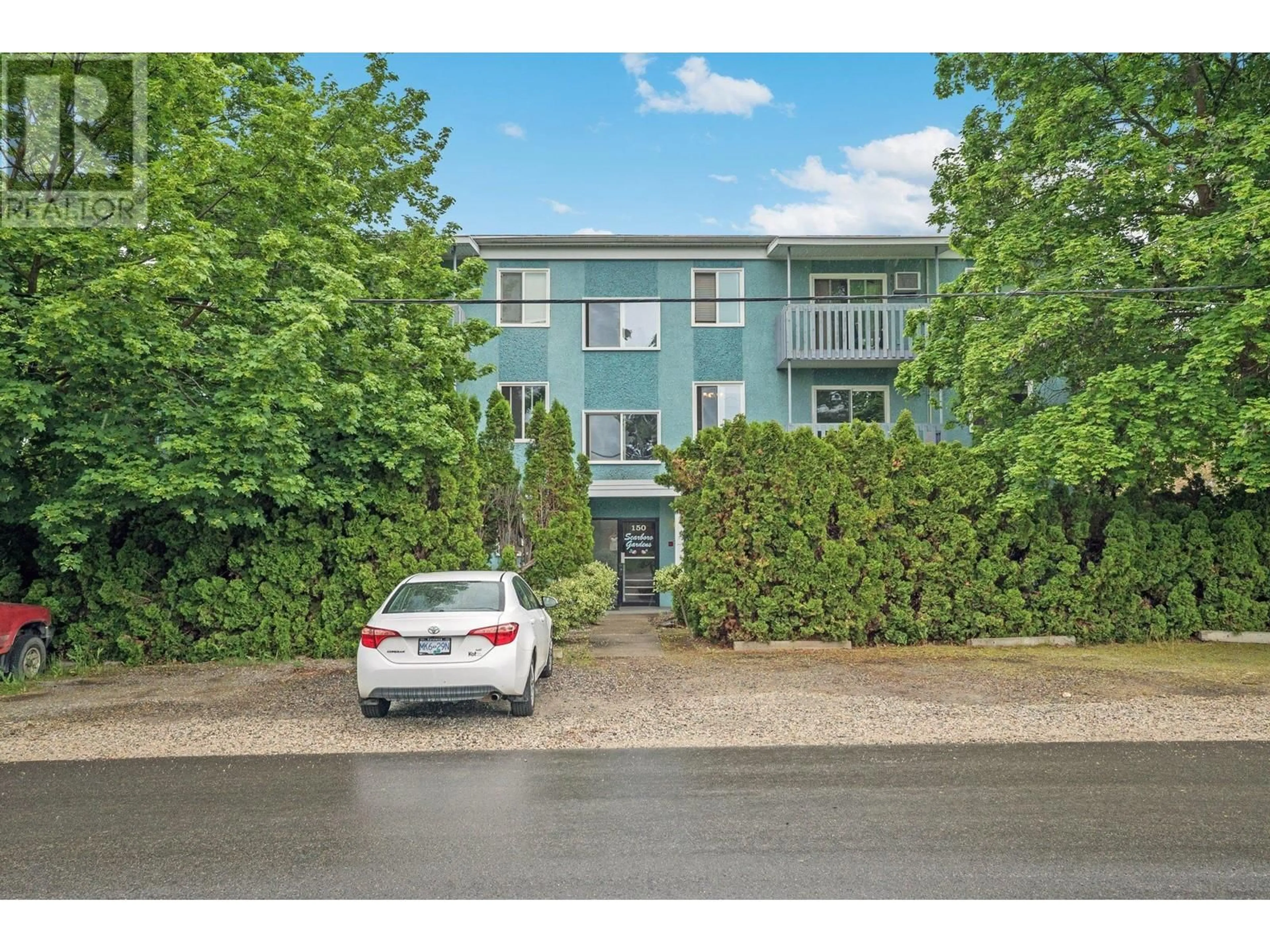 A pic from outside/outdoor area/front of a property/back of a property/a pic from drone, street for 202 - 150 SCARBORO ROAD, Kelowna British Columbia V1X1M2