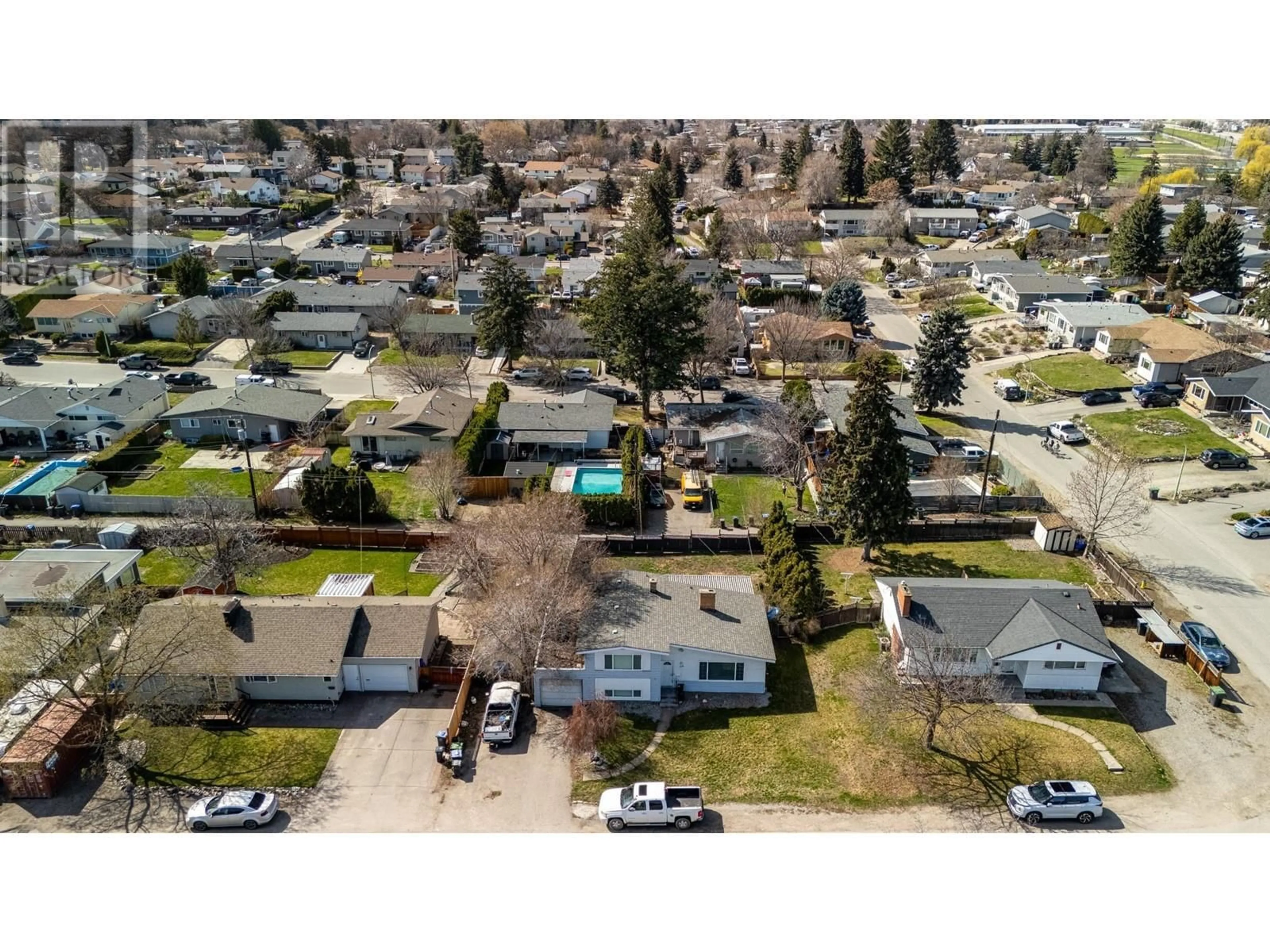 A pic from outside/outdoor area/front of a property/back of a property/a pic from drone, mountain view for 1388 CHERRY CRESCENT WEST, Kelowna British Columbia V1Y3X8