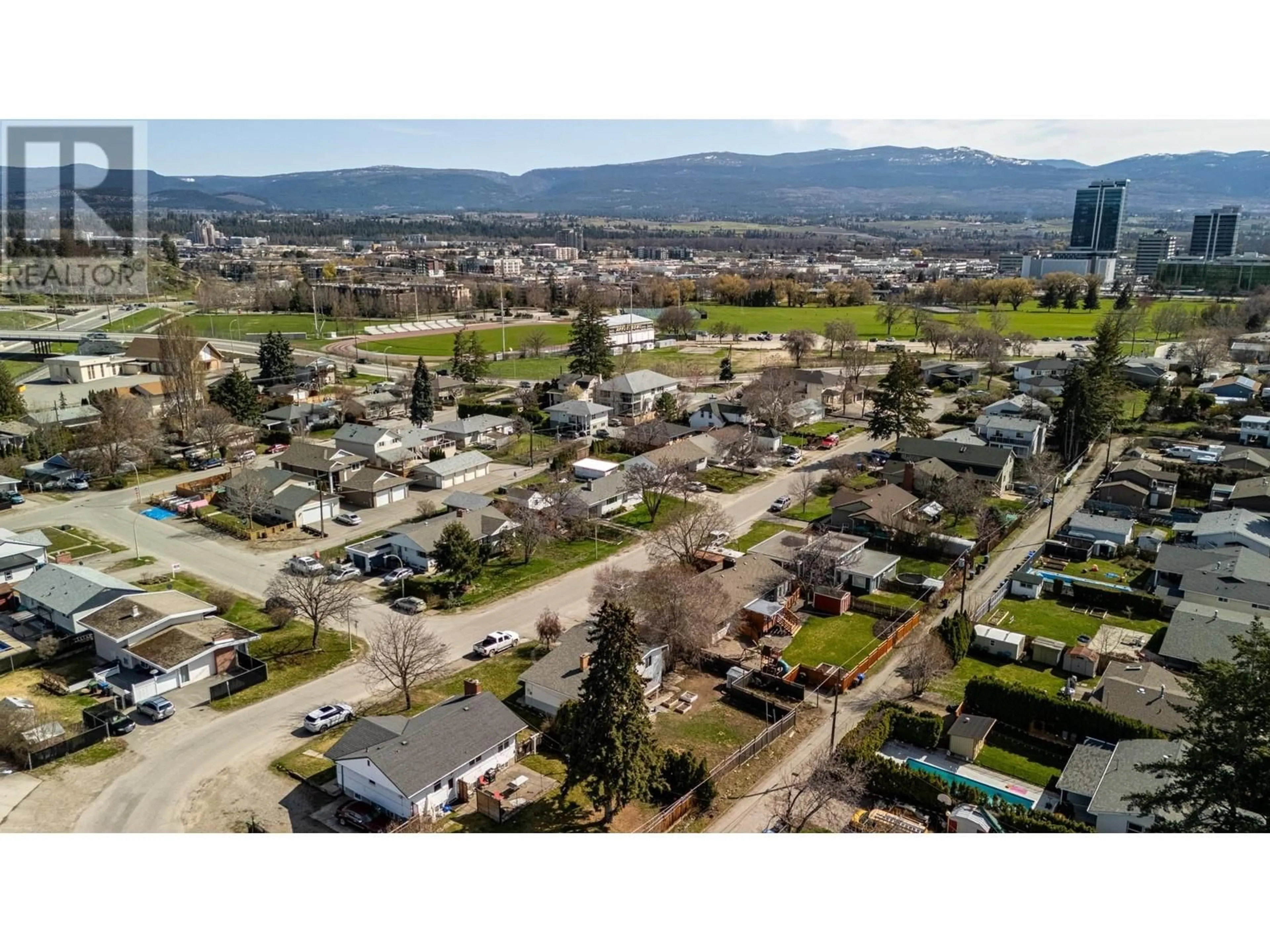A pic from outside/outdoor area/front of a property/back of a property/a pic from drone, mountain view for 1388 CHERRY CRESCENT WEST, Kelowna British Columbia V1Y3X8
