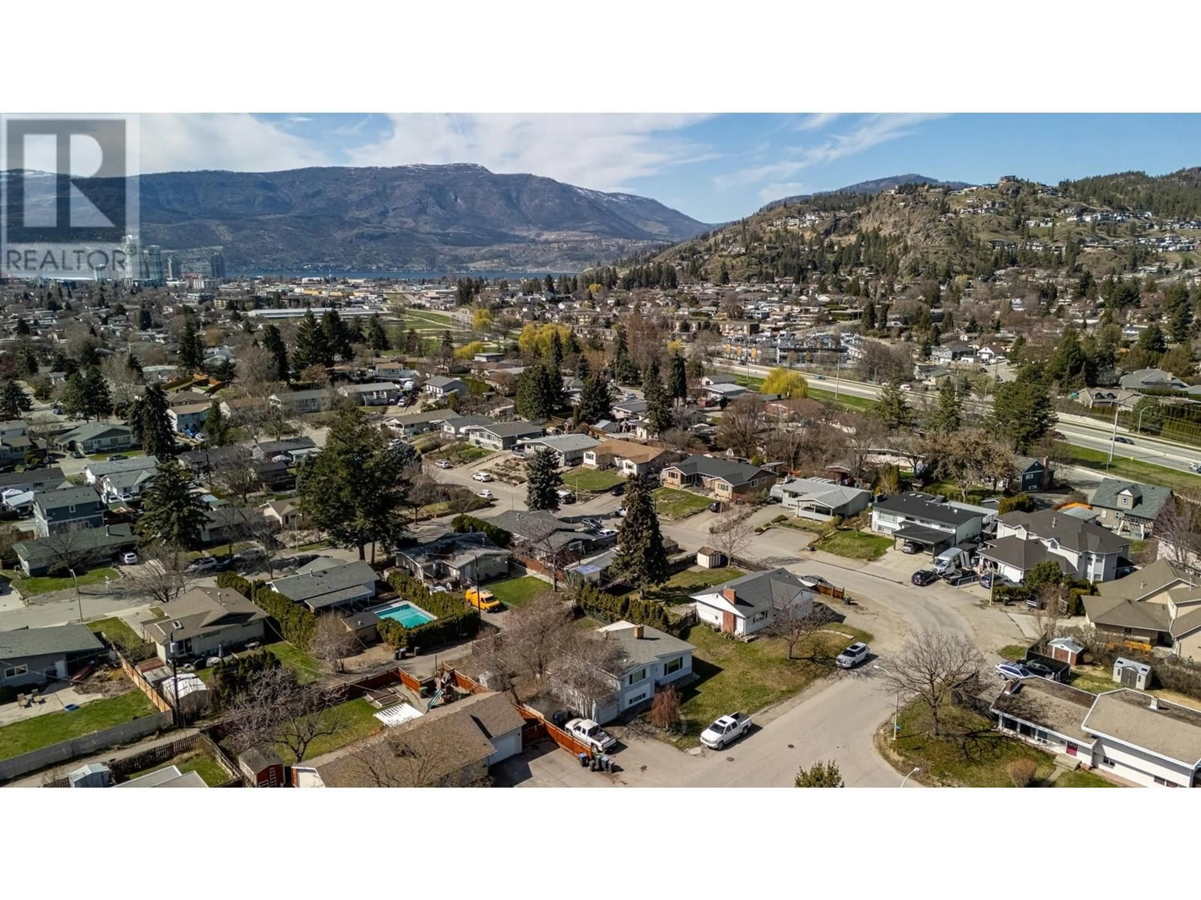 A pic from outside/outdoor area/front of a property/back of a property/a pic from drone, mountain view for 1388 CHERRY CRESCENT WEST, Kelowna British Columbia V1Y3X8