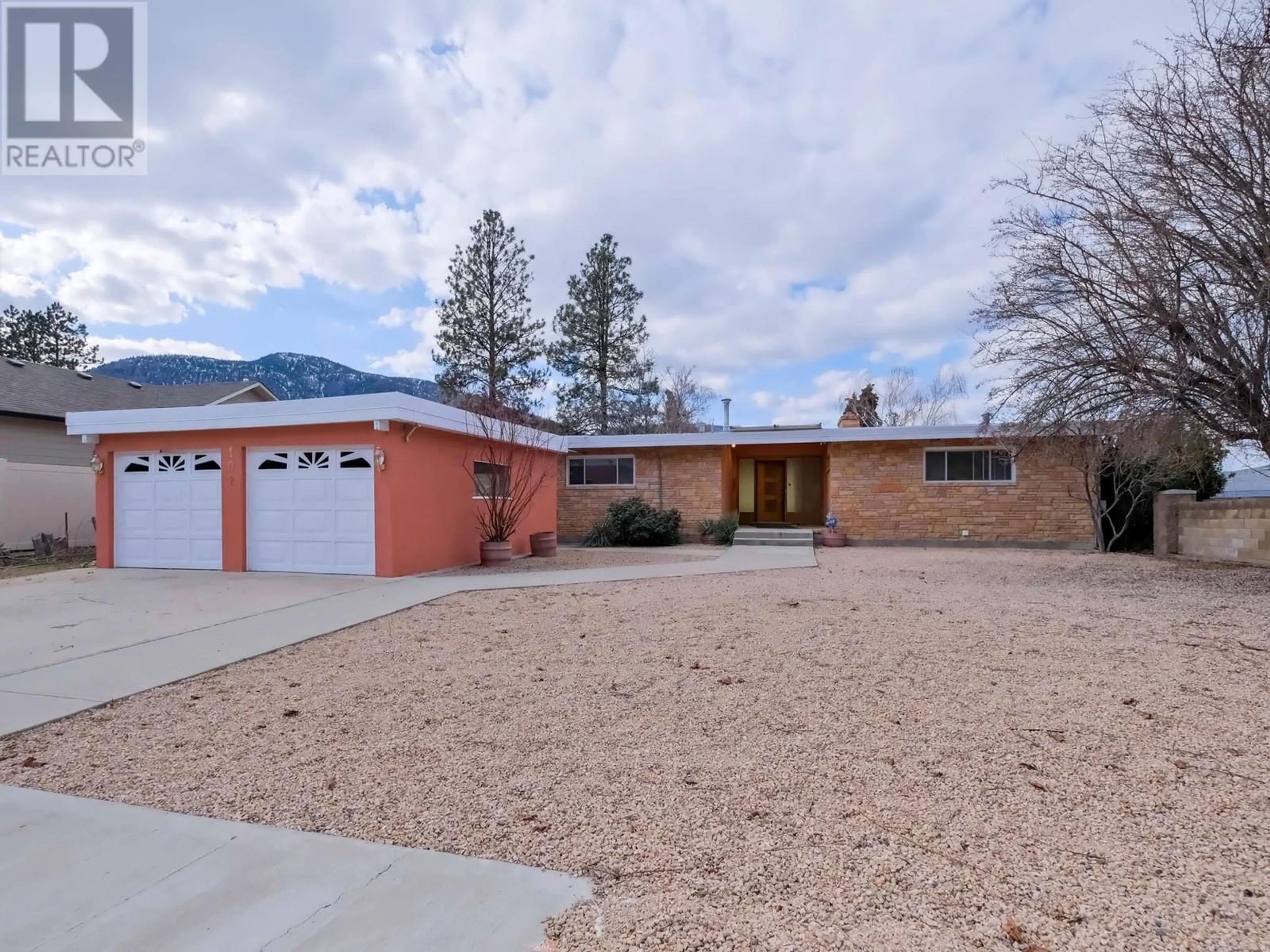 Home with brick exterior material, mountain view for 102 DERENZY PLACE, Penticton British Columbia V2A8W7