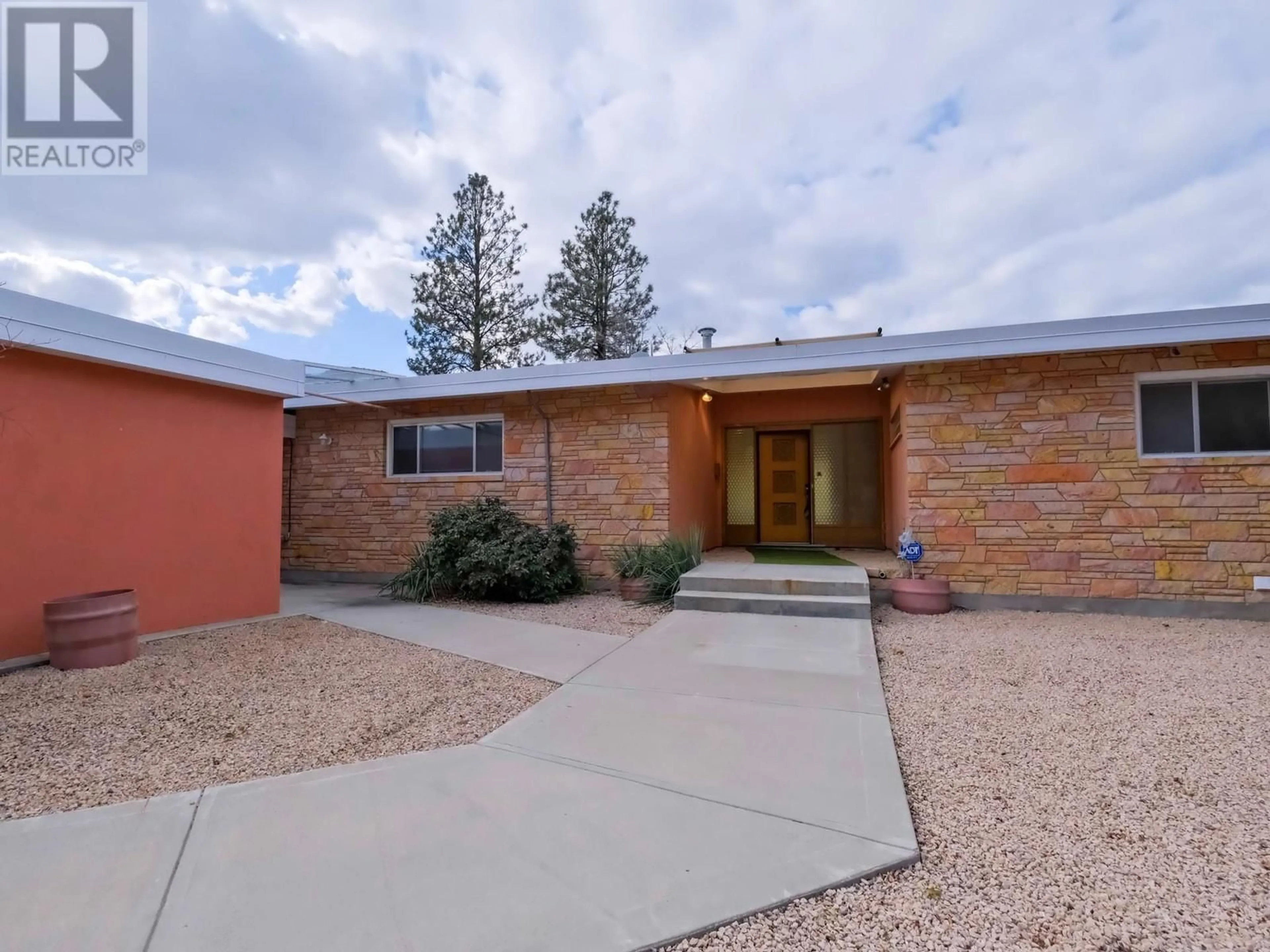 Home with brick exterior material, street for 102 DERENZY PLACE, Penticton British Columbia V2A8W7