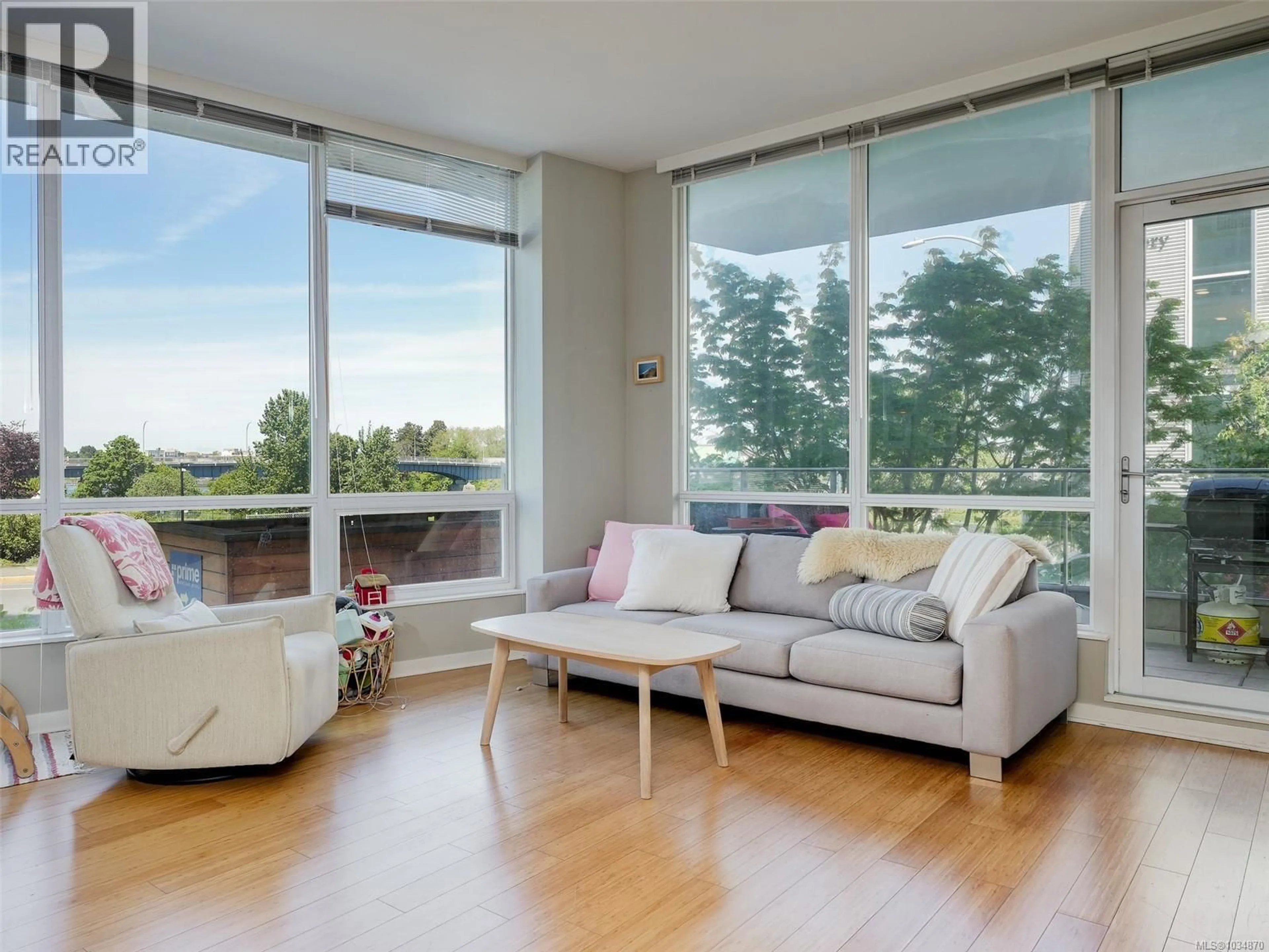Living room with furniture, unknown for 105 - 399 TYEE ROAD, Victoria British Columbia V9A0A8