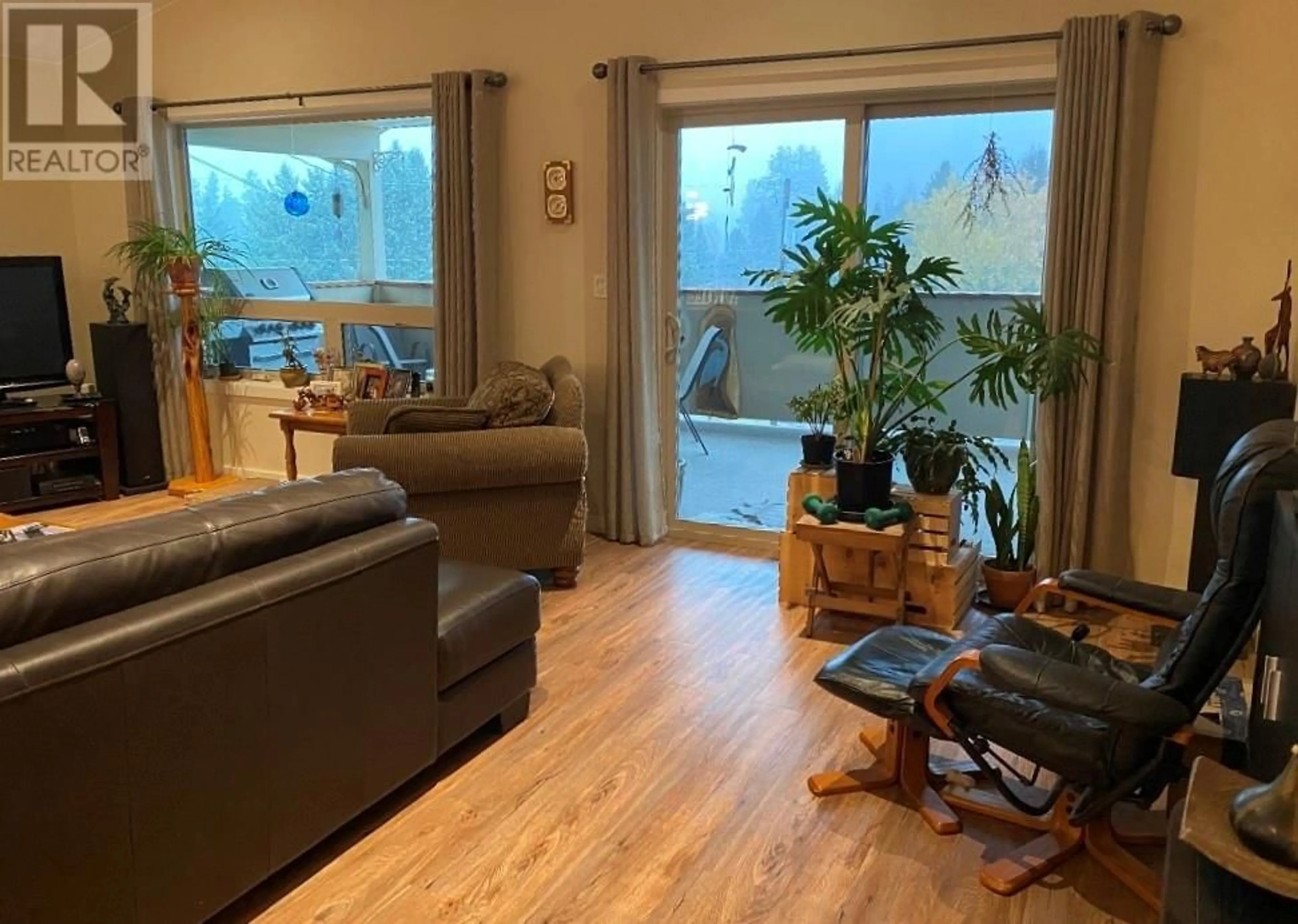 Living room with furniture, wood/laminate floor for 4045 VALE AVENUE, Grand Forks British Columbia V0H1H5