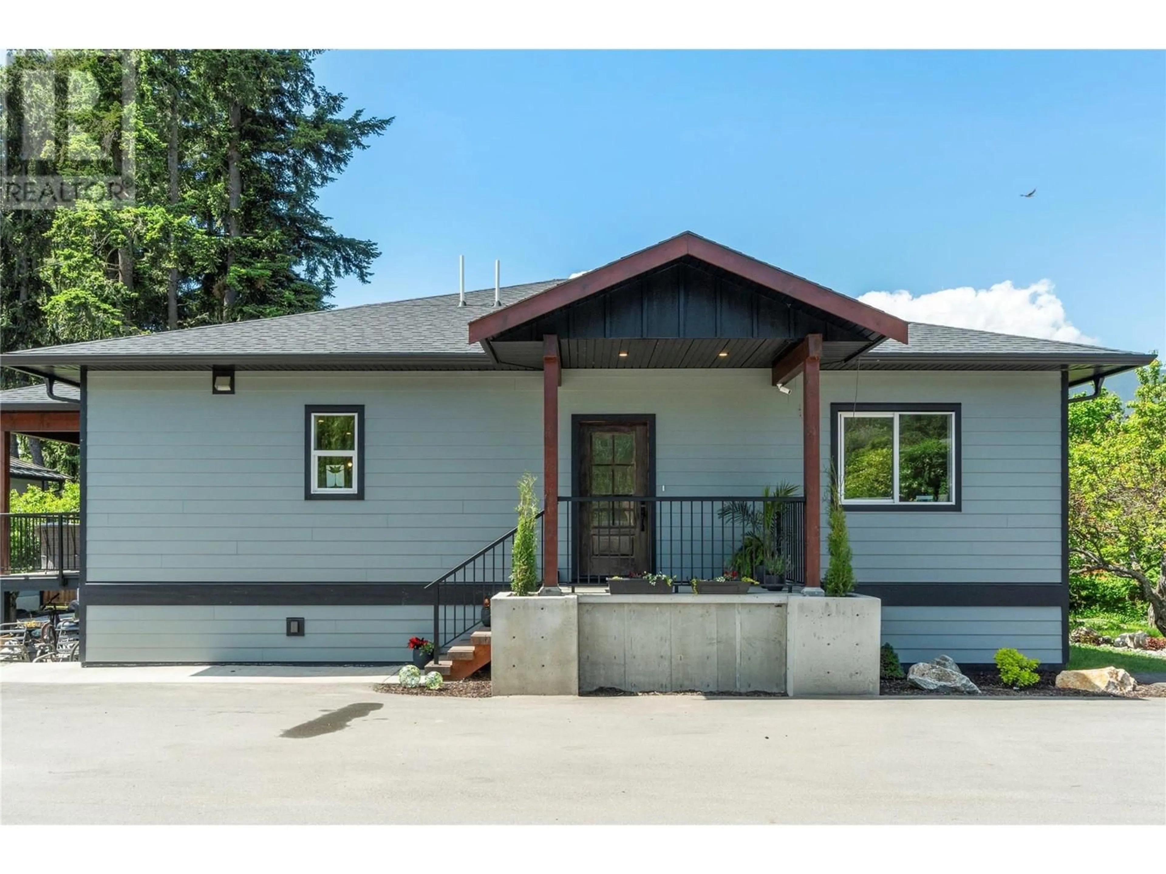 Home with vinyl exterior material, street for 1240 52 AVENUE, Salmon Arm British Columbia V1E3M8