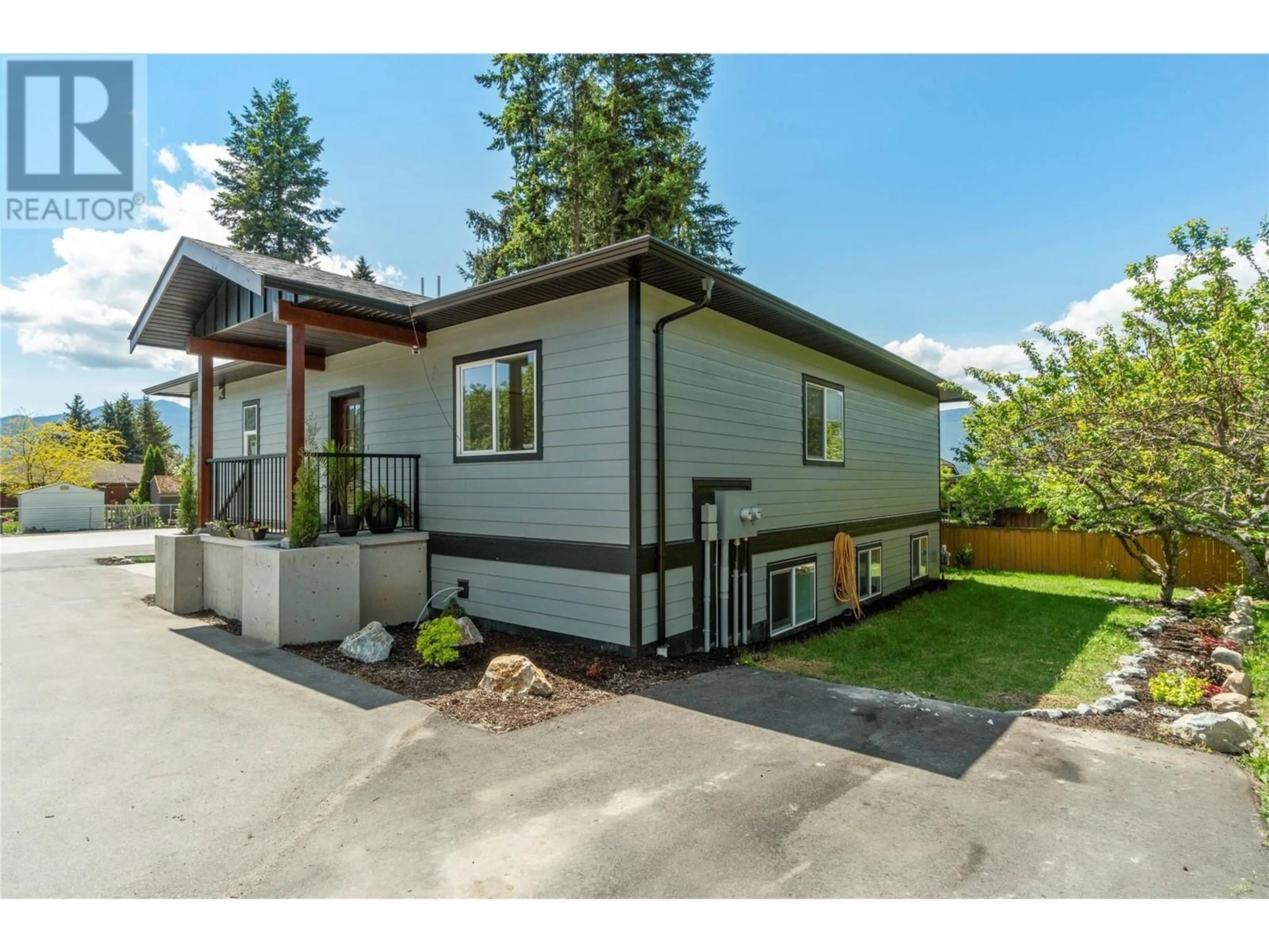 Home with vinyl exterior material, street for 1240 52 AVENUE, Salmon Arm British Columbia V1E3M8