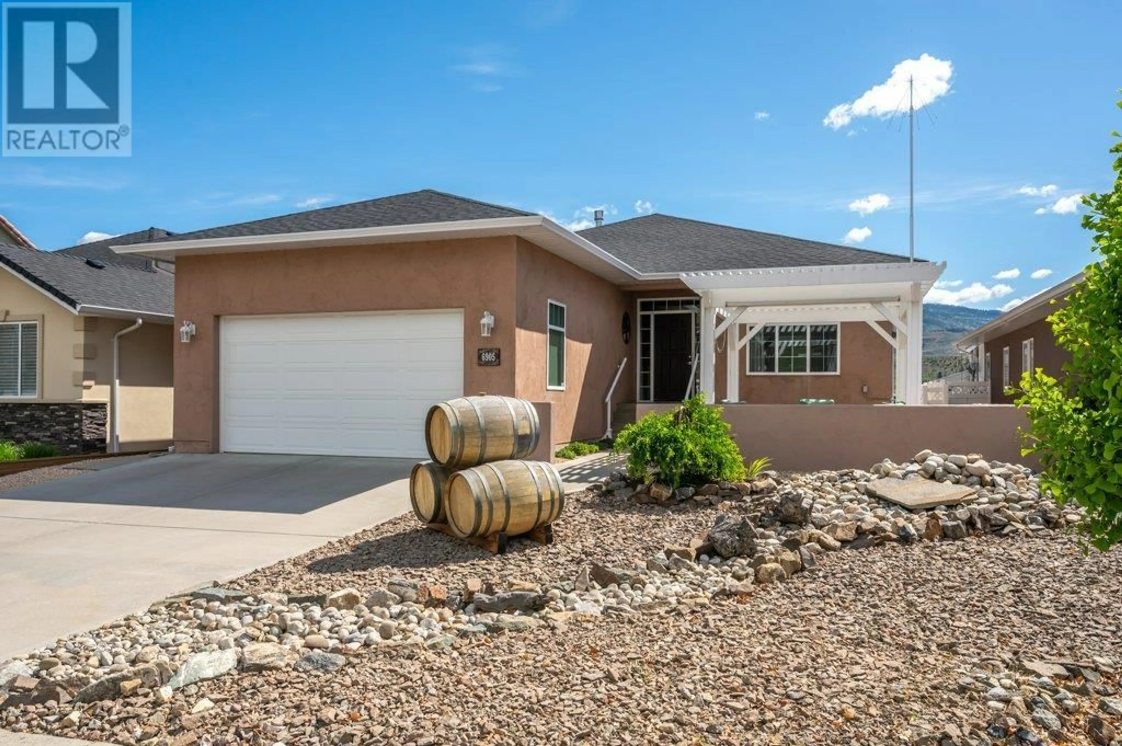 Home with vinyl exterior material, street for 6905 MOUNTAINVIEW DRIVE, Oliver British Columbia V0H1T4