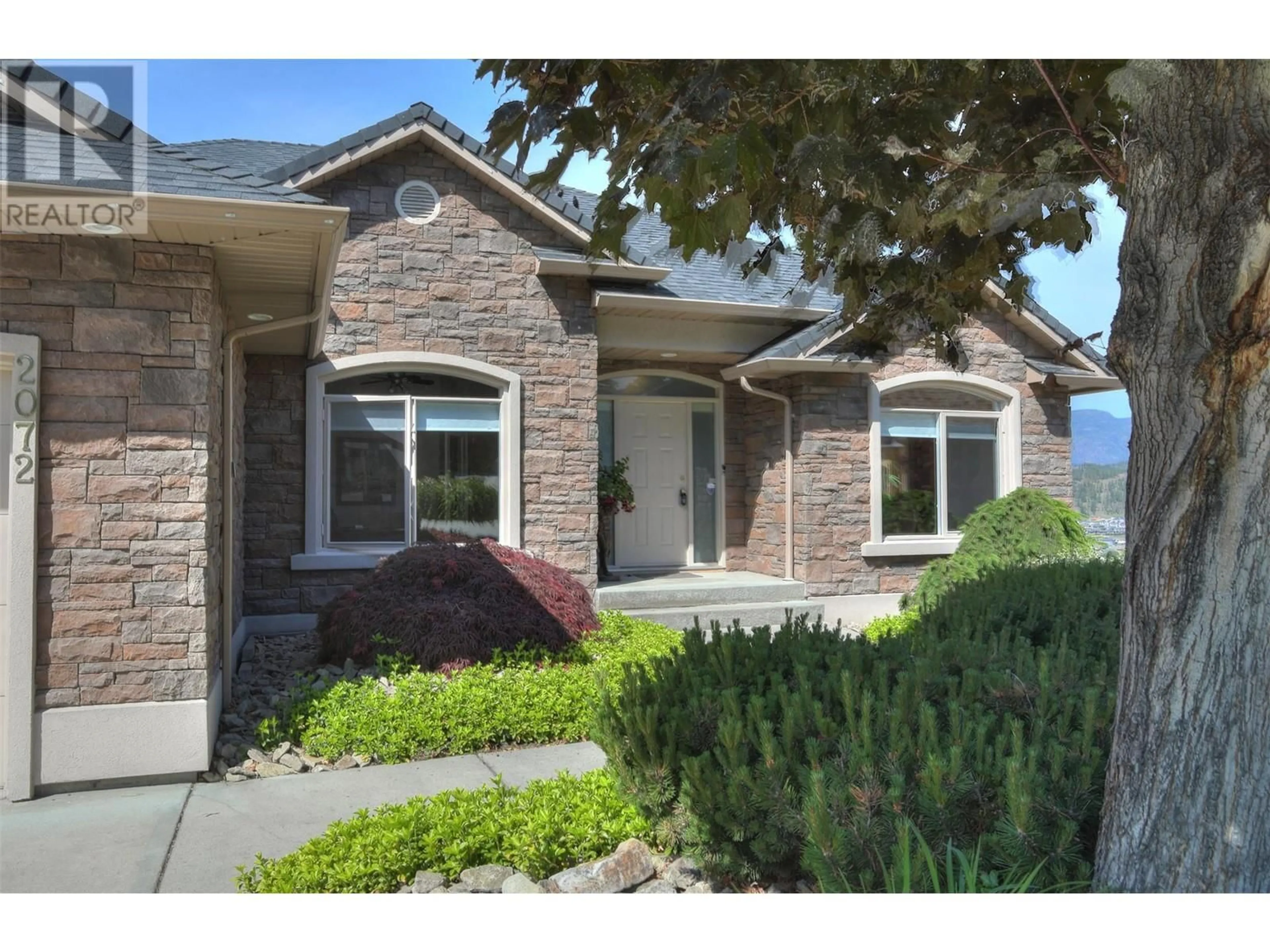 Home with brick exterior material, street for 2072 LILLOOET COURT, Kelowna British Columbia V1Y1V2