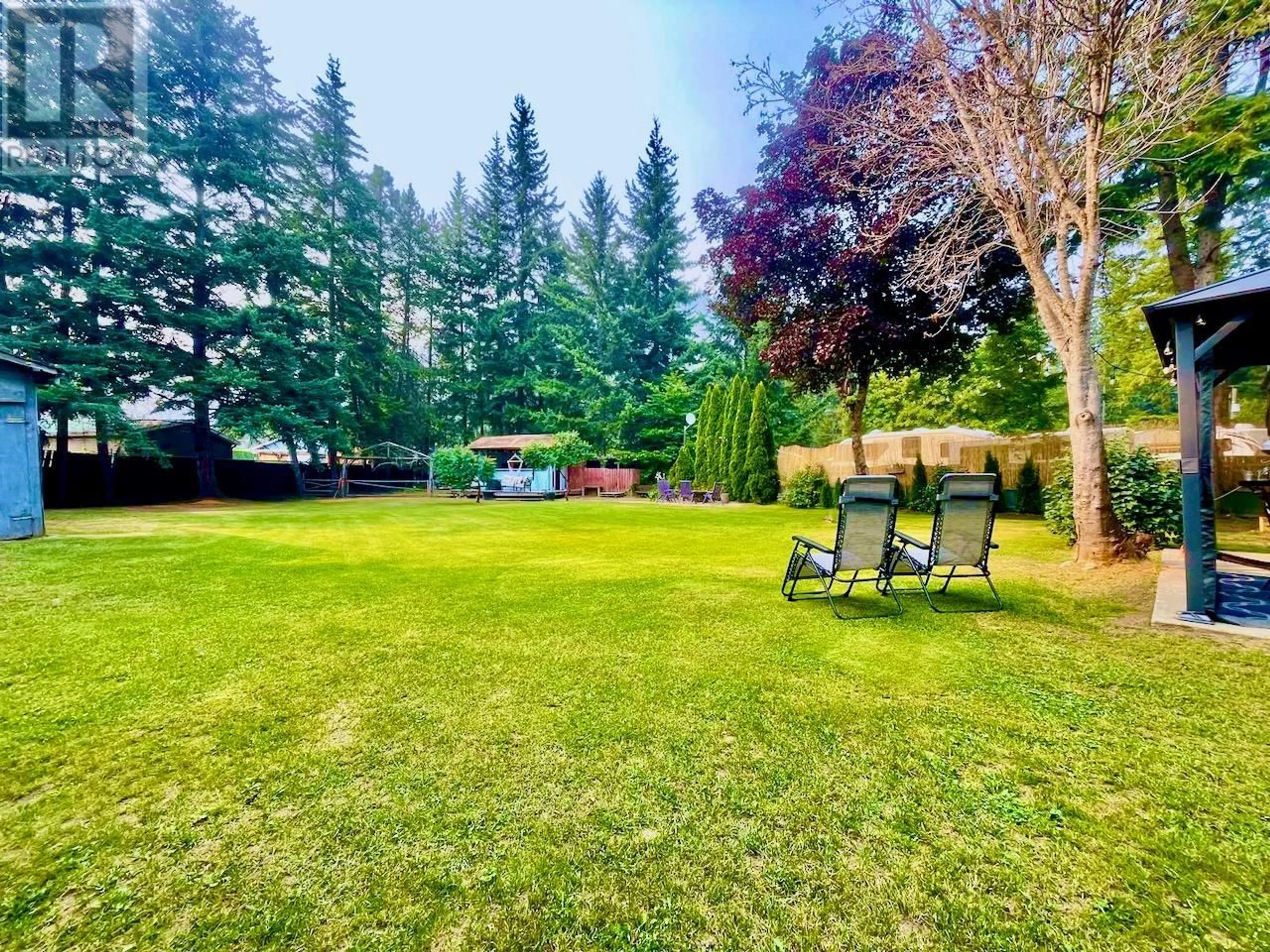 A pic from outside/outdoor area/front of a property/back of a property/a pic from drone, forest/trees view for 4179 ASHE CRESCENT, Scotch Creek British Columbia V0E1M5