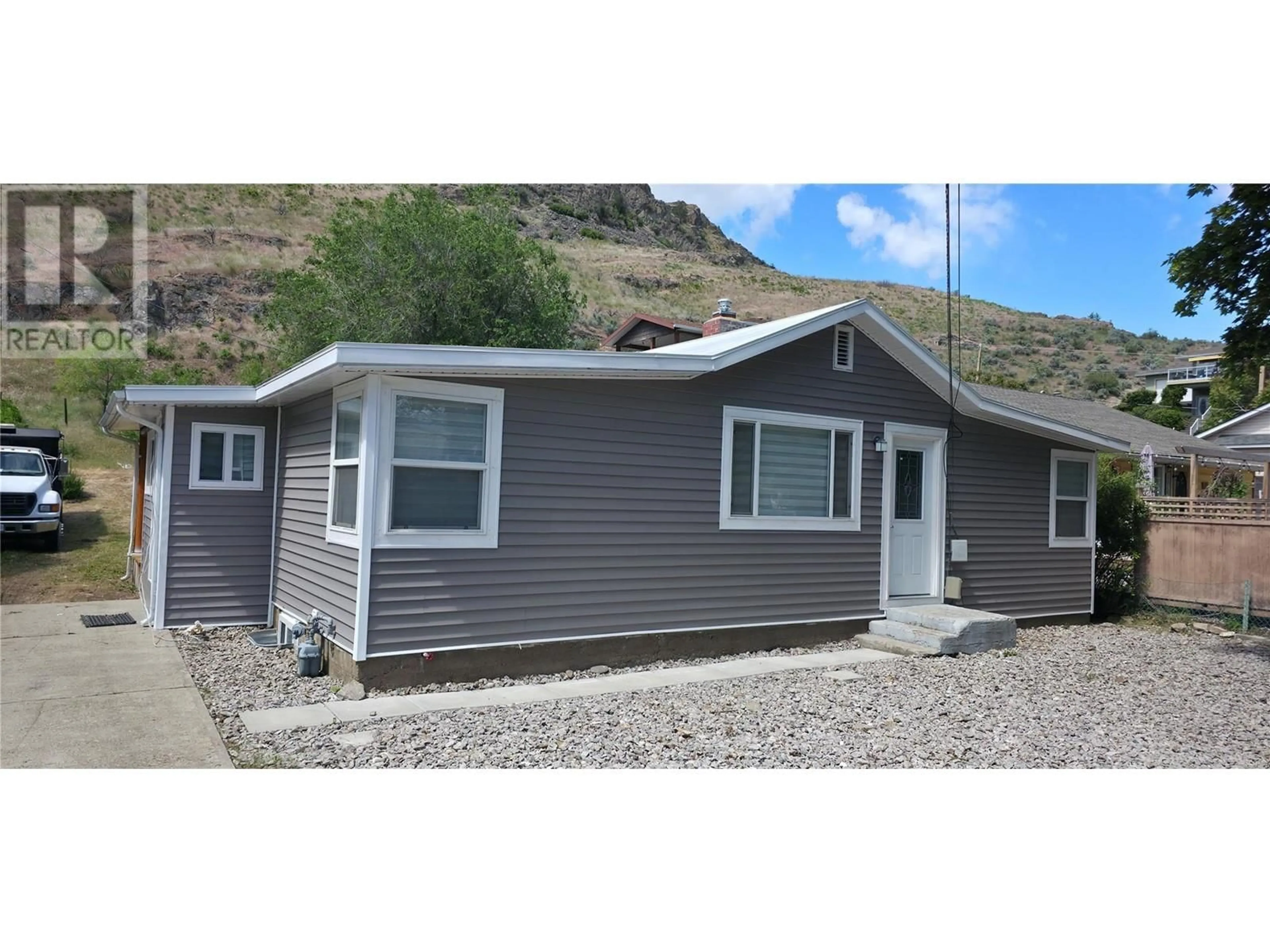 Home with vinyl exterior material, street for 6176 SPARTAN STREET, Oliver British Columbia V0H1T6