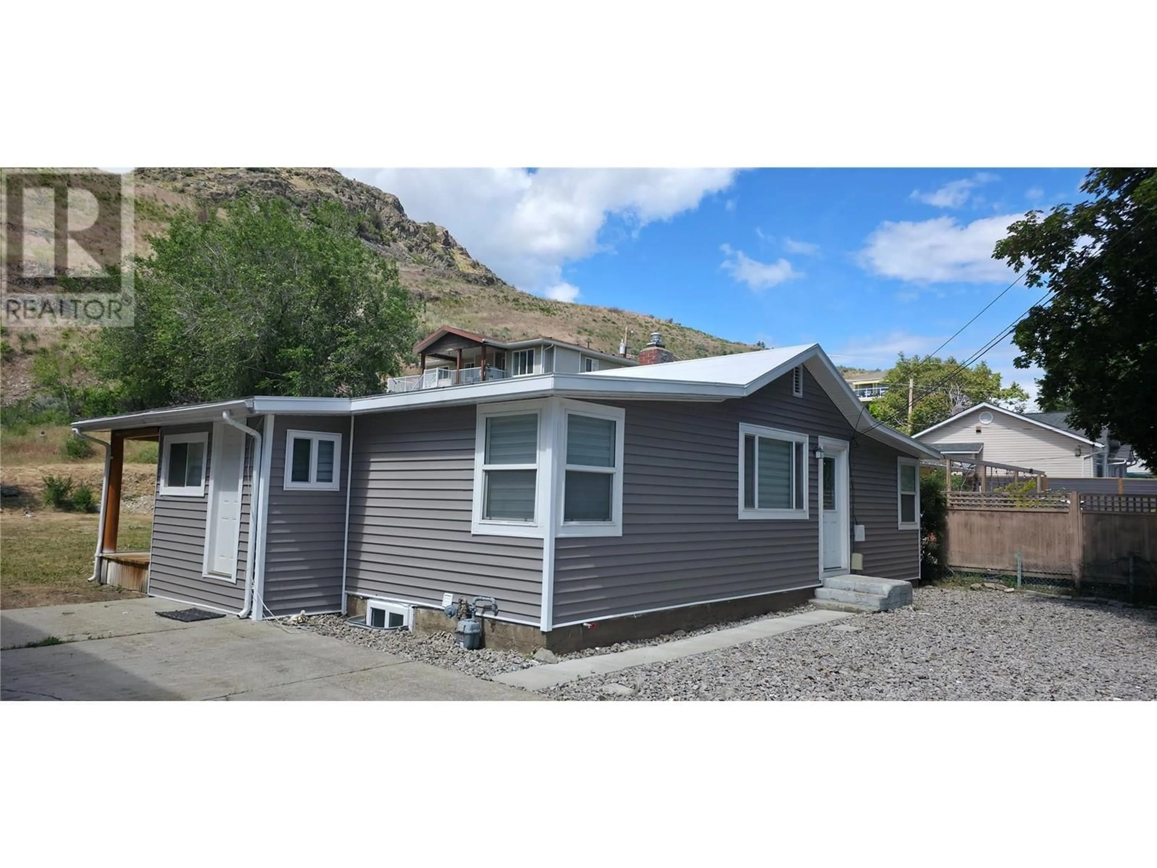Home with vinyl exterior material, street for 6176 SPARTAN STREET, Oliver British Columbia V0H1T6