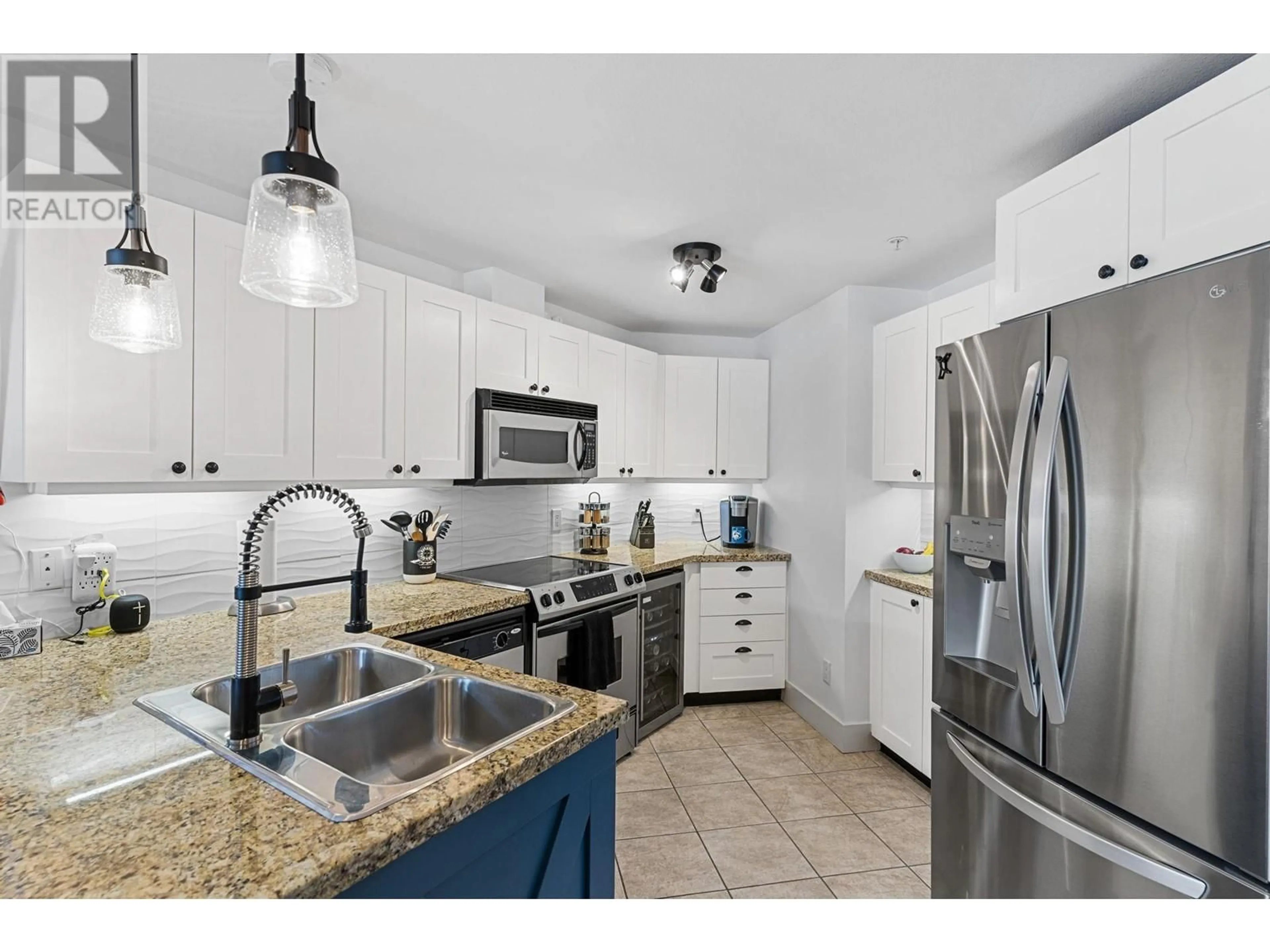 Open concept kitchen, ceramic/tile floor for 311 - 4205 GELLATLY ROAD, West Kelowna British Columbia V4T2K2