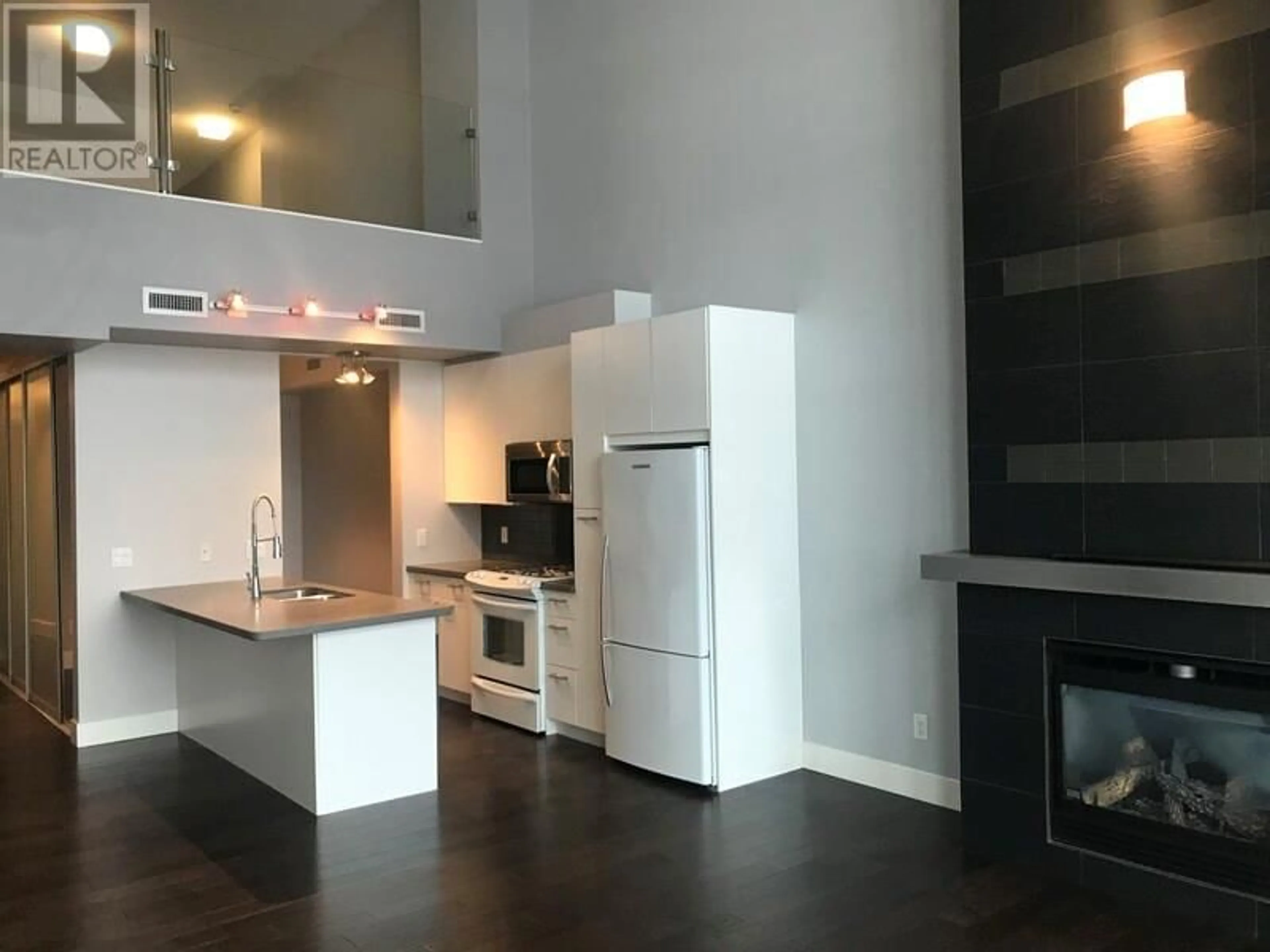 Open concept kitchen, unknown for 411 - 1289 ELLIS STREET, Kelowna British Columbia V1Y9X6