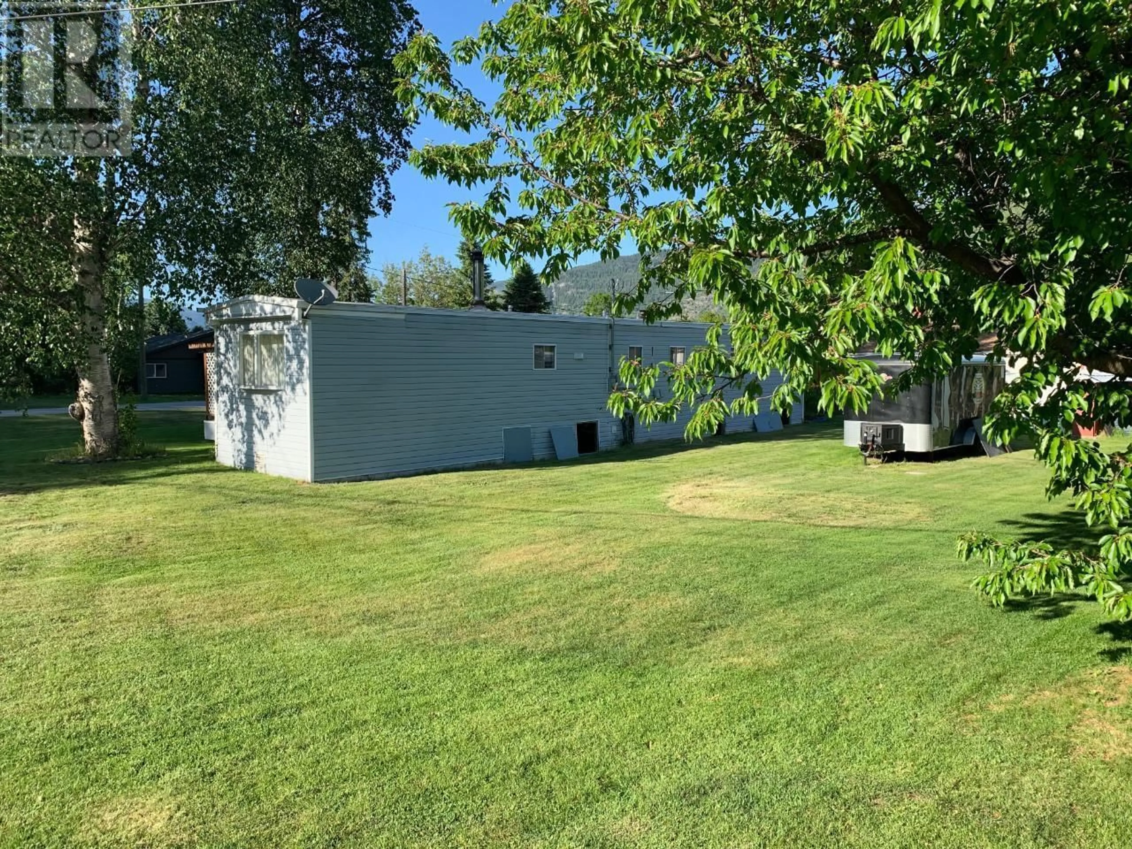 A pic from outside/outdoor area/front of a property/back of a property/a pic from drone, unknown for 1 - 152 SCHULTE CRESCENT, Castlegar British Columbia V1N3E2