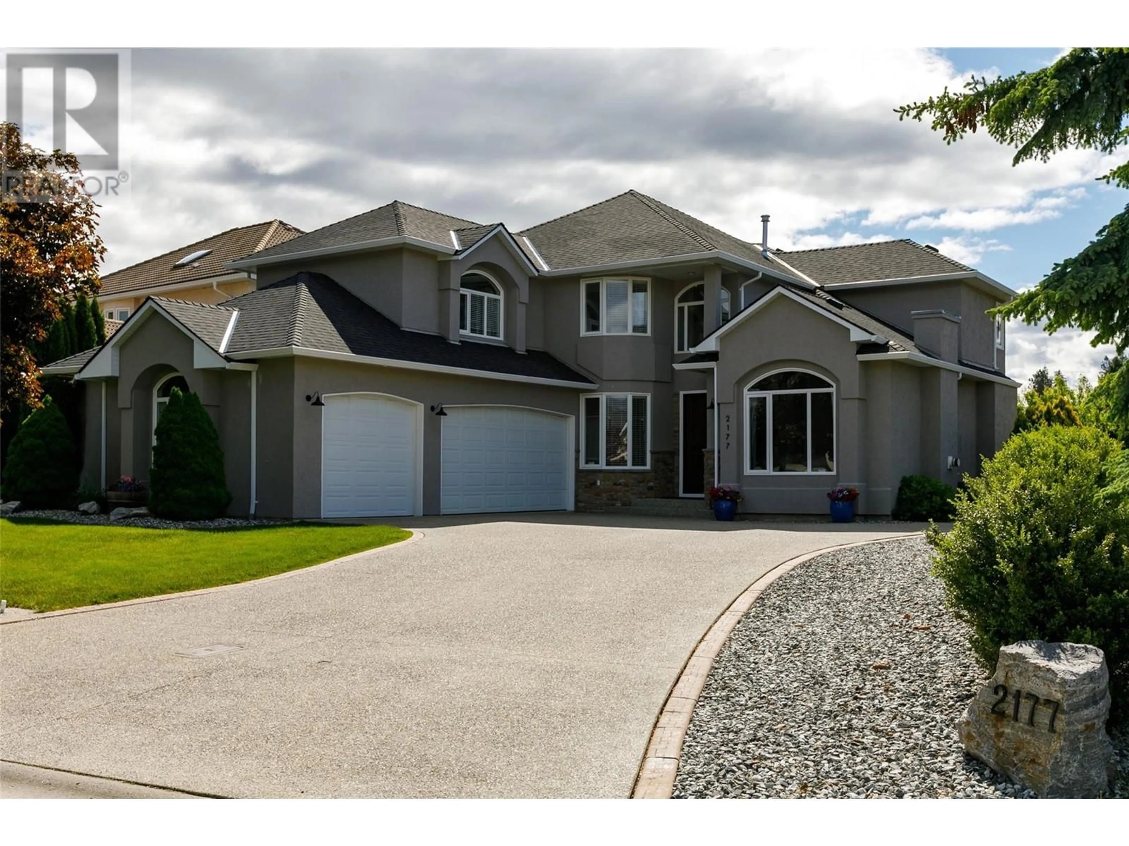 Home with vinyl exterior material, street for 2177 BRECKENRIDGE COURT, Kelowna British Columbia V1V1W2