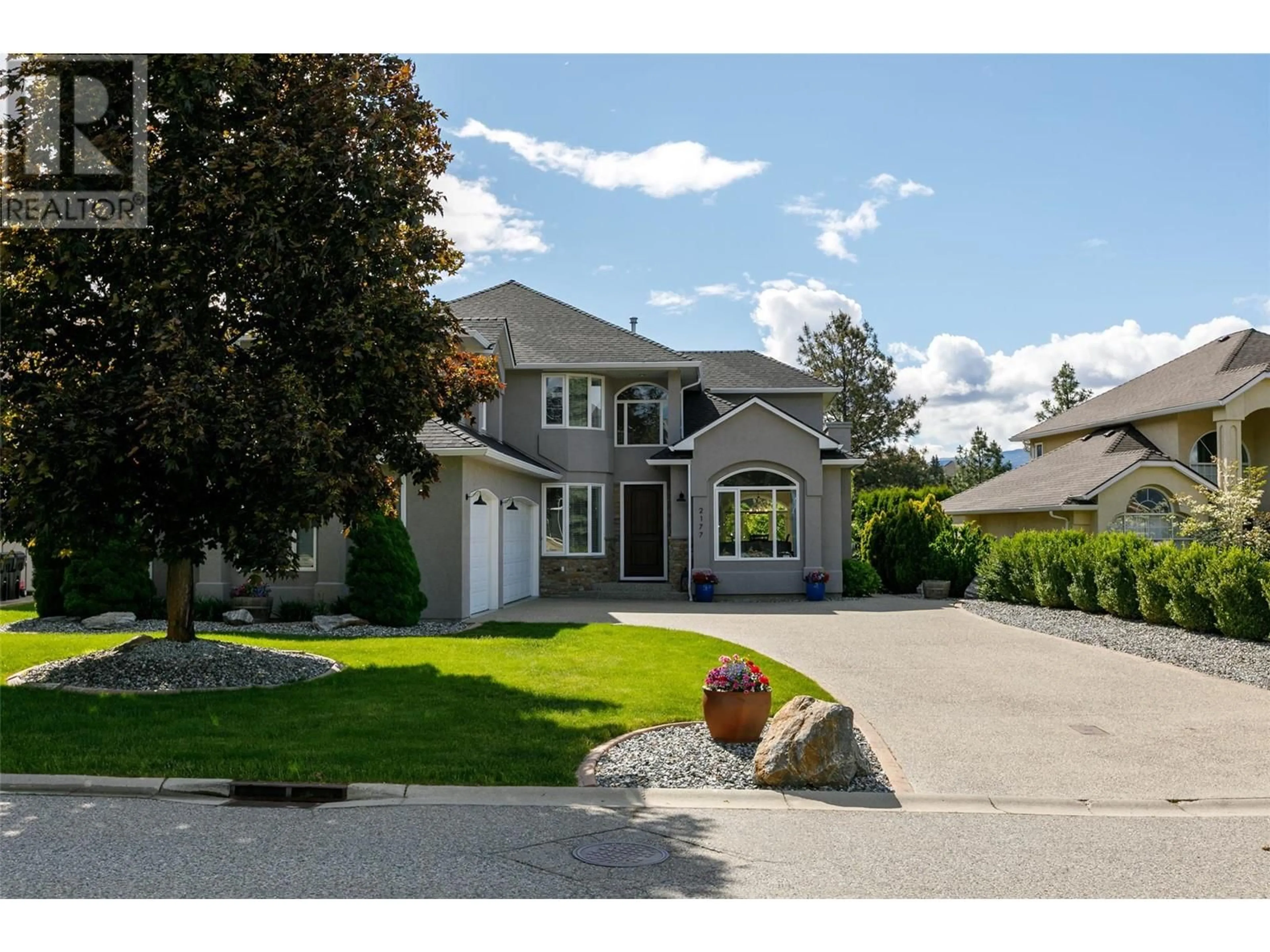 Home with vinyl exterior material, street for 2177 BRECKENRIDGE COURT, Kelowna British Columbia V1V1W2