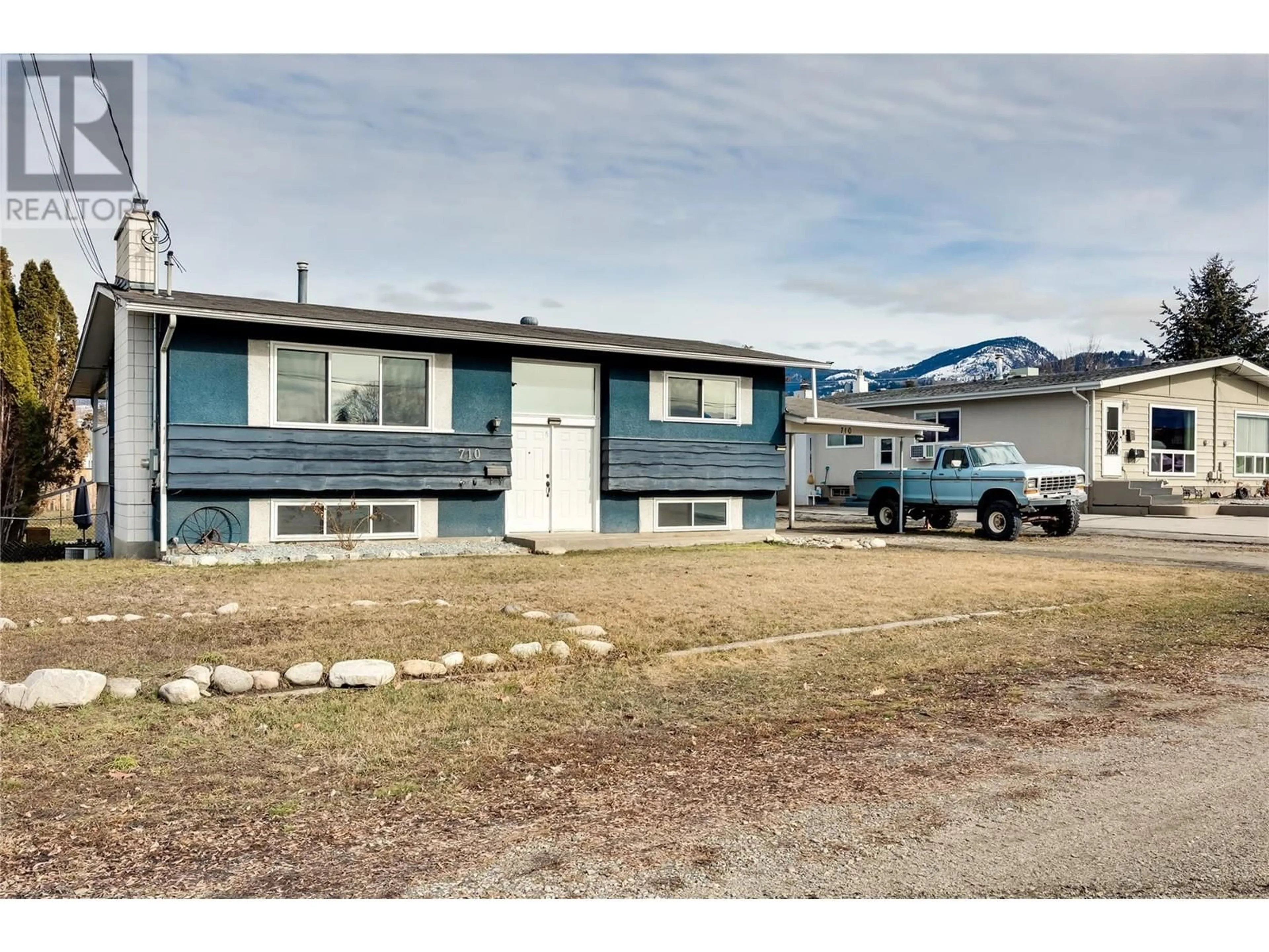 Home with vinyl exterior material, street for 710 HOLLYDELL ROAD, Kelowna British Columbia V1X1L5