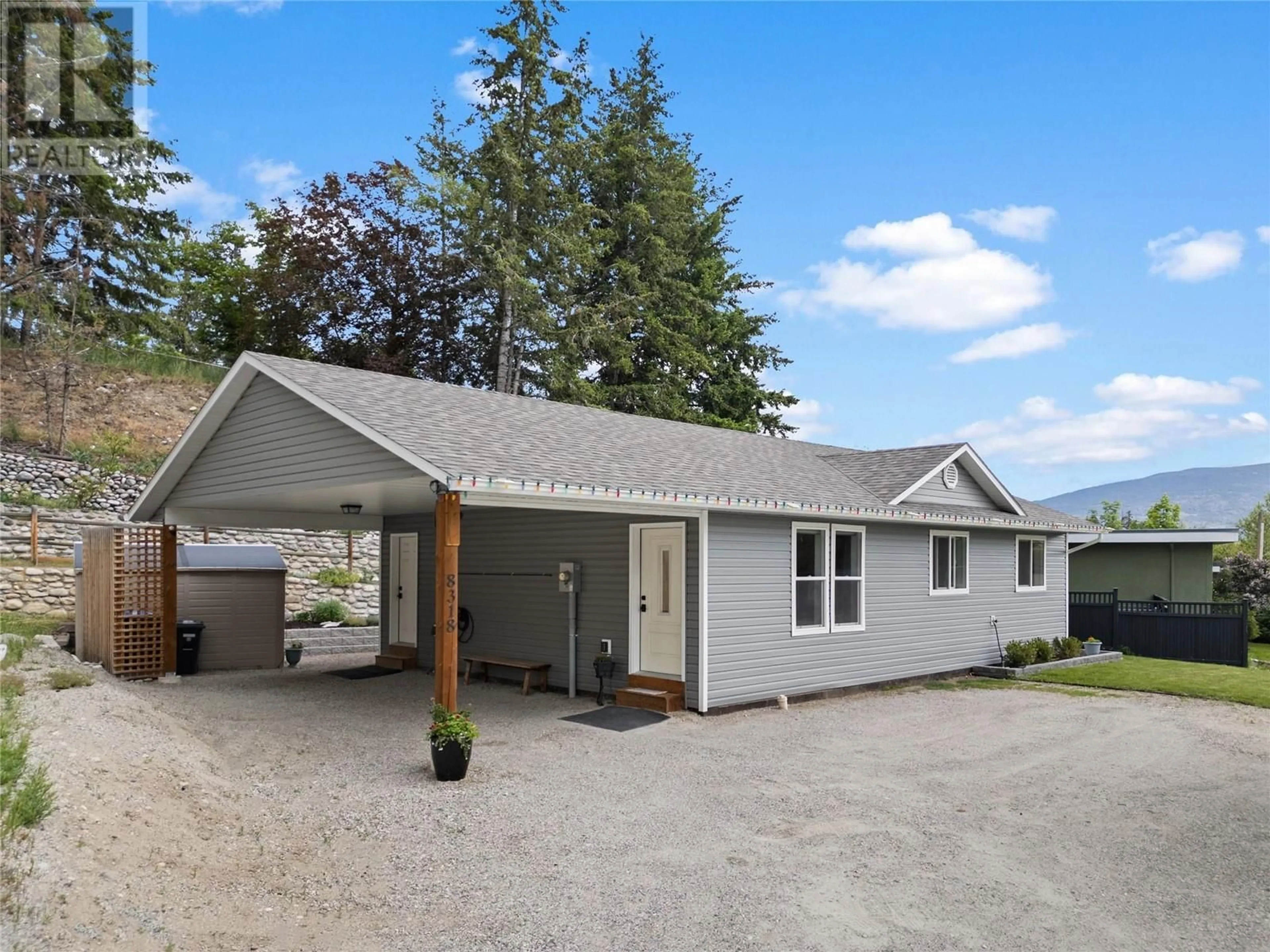 Home with vinyl exterior material, street for 8318 PRAIRIE VALLEY ROAD, Summerland British Columbia V0H1Z4