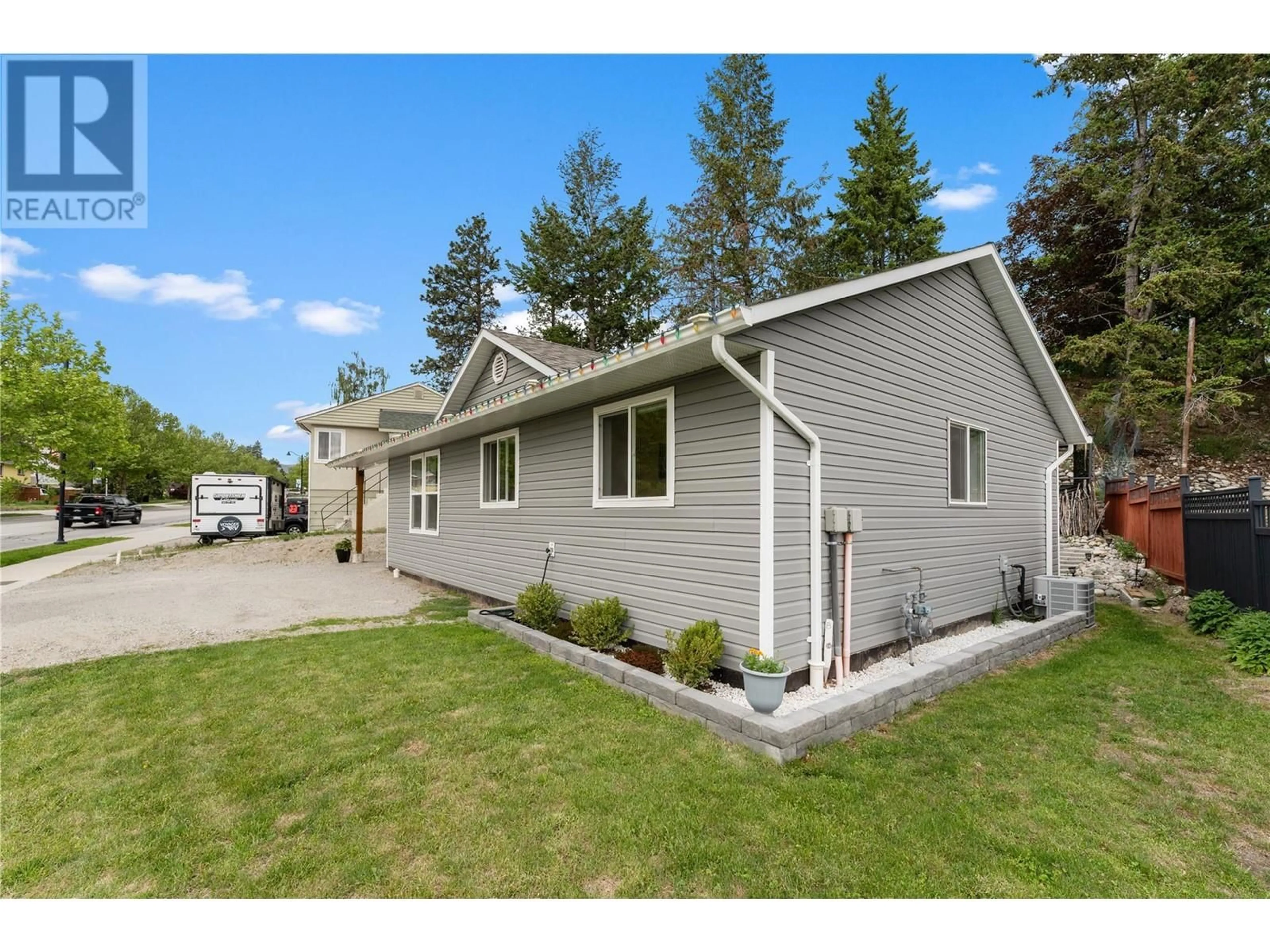 Home with vinyl exterior material, street for 8318 PRAIRIE VALLEY ROAD, Summerland British Columbia V0H1Z4