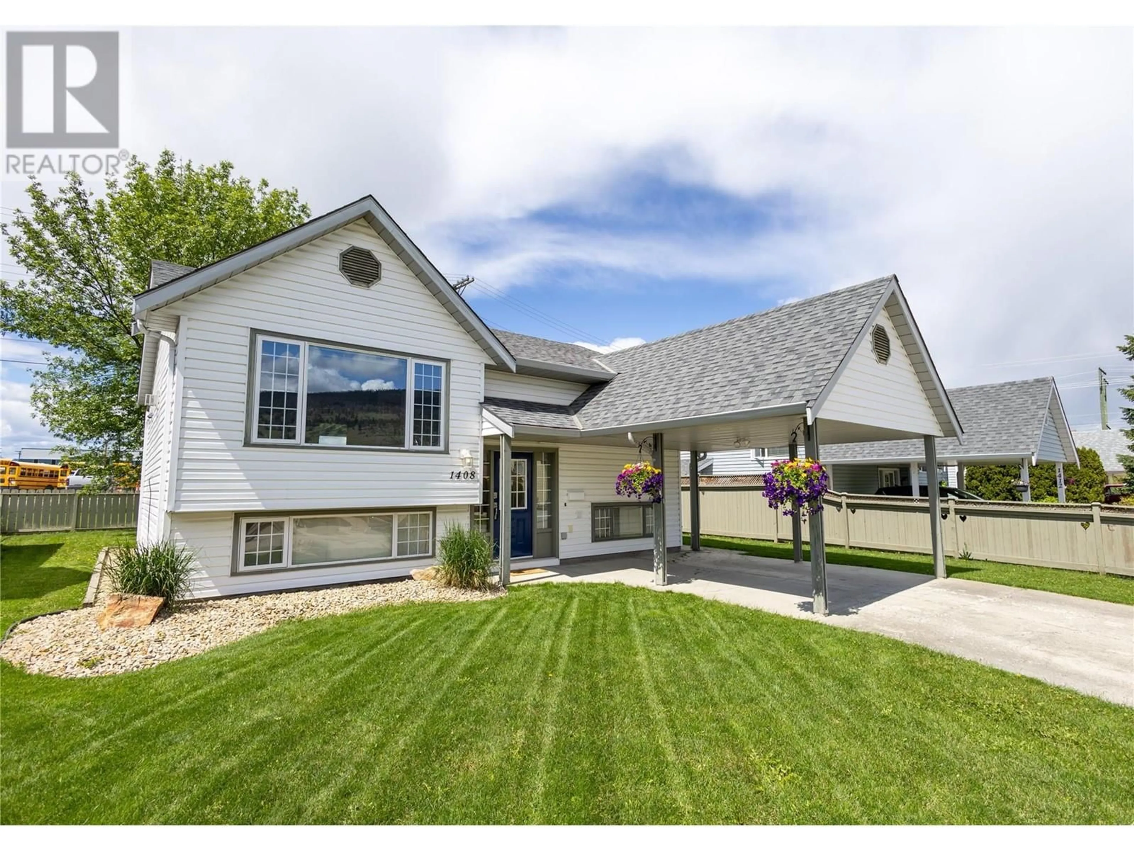 Home with vinyl exterior material, street for 1408 12 STREET, Vernon British Columbia V1B2S6