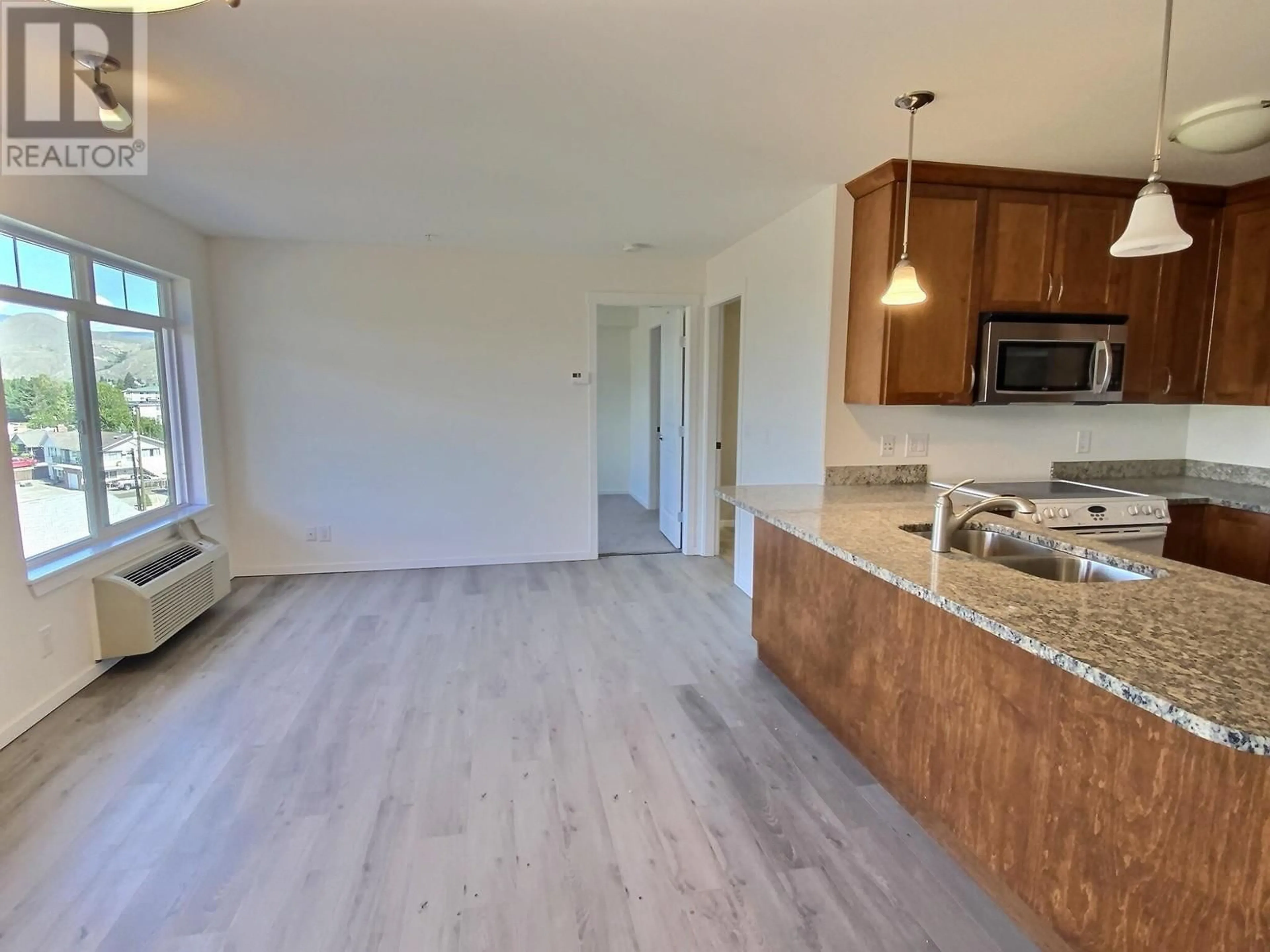 Open concept kitchen, wood/laminate floor for 508 - 689 TRANQUILLE ROAD, Kamloops British Columbia V2B0C7