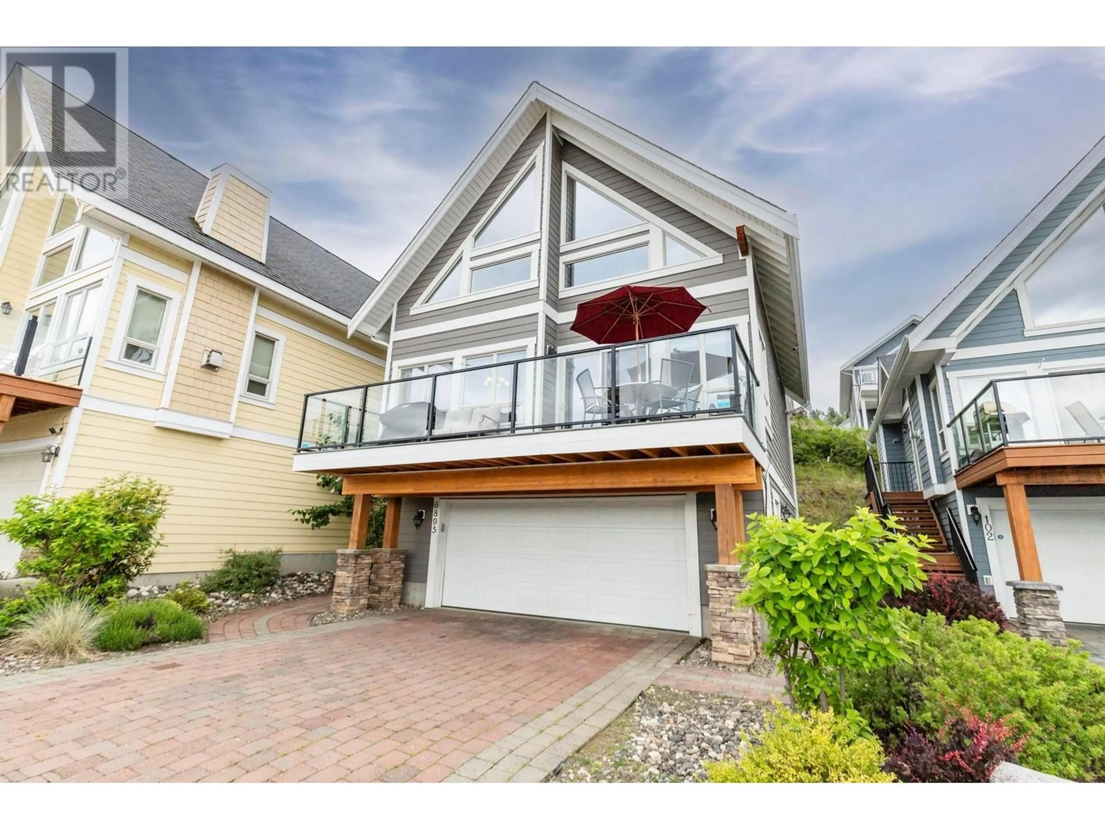 Home with vinyl exterior material, street for 6895 SANTIAGO LOOP, Kelowna British Columbia V1Z3R8