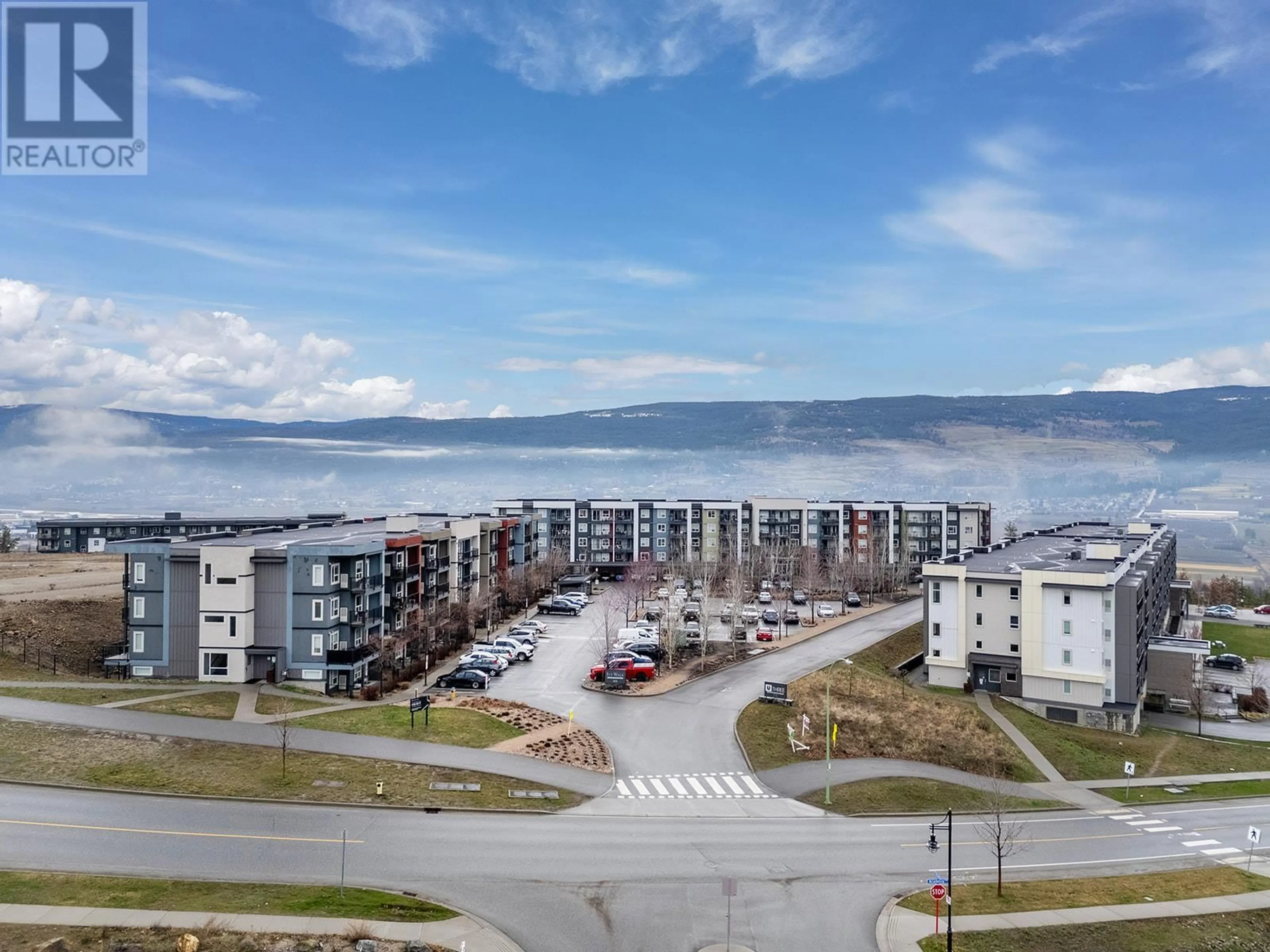 A pic from outside/outdoor area/front of a property/back of a property/a pic from drone, mountain view for 312 - 775 ACADEMY WAY, Kelowna British Columbia V1V0A5