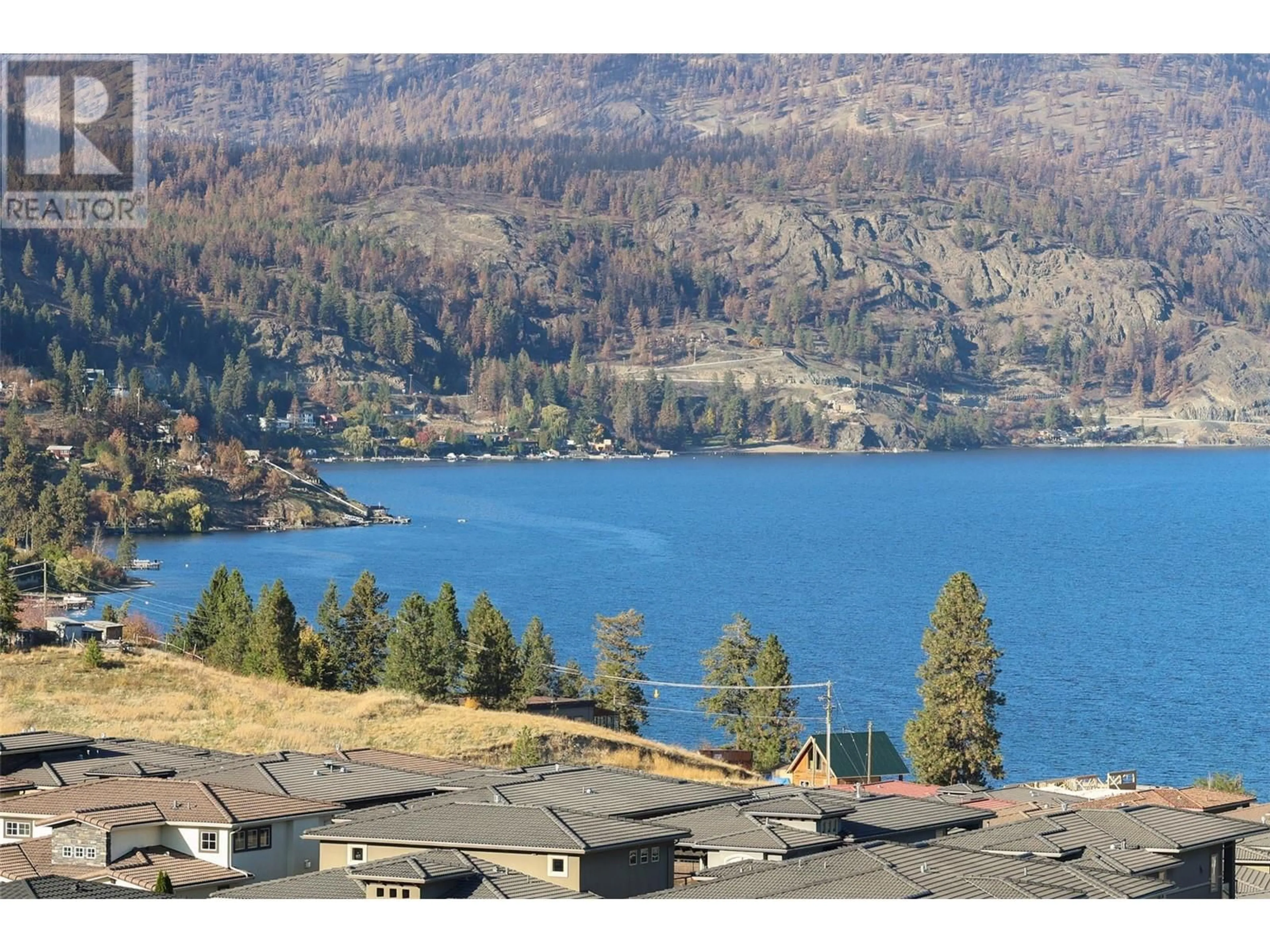 A pic from outside/outdoor area/front of a property/back of a property/a pic from drone, water/lake/river/ocean view for 3503 - 3000 ARIVA DRIVE, Kelowna British Columbia V1Z0B3