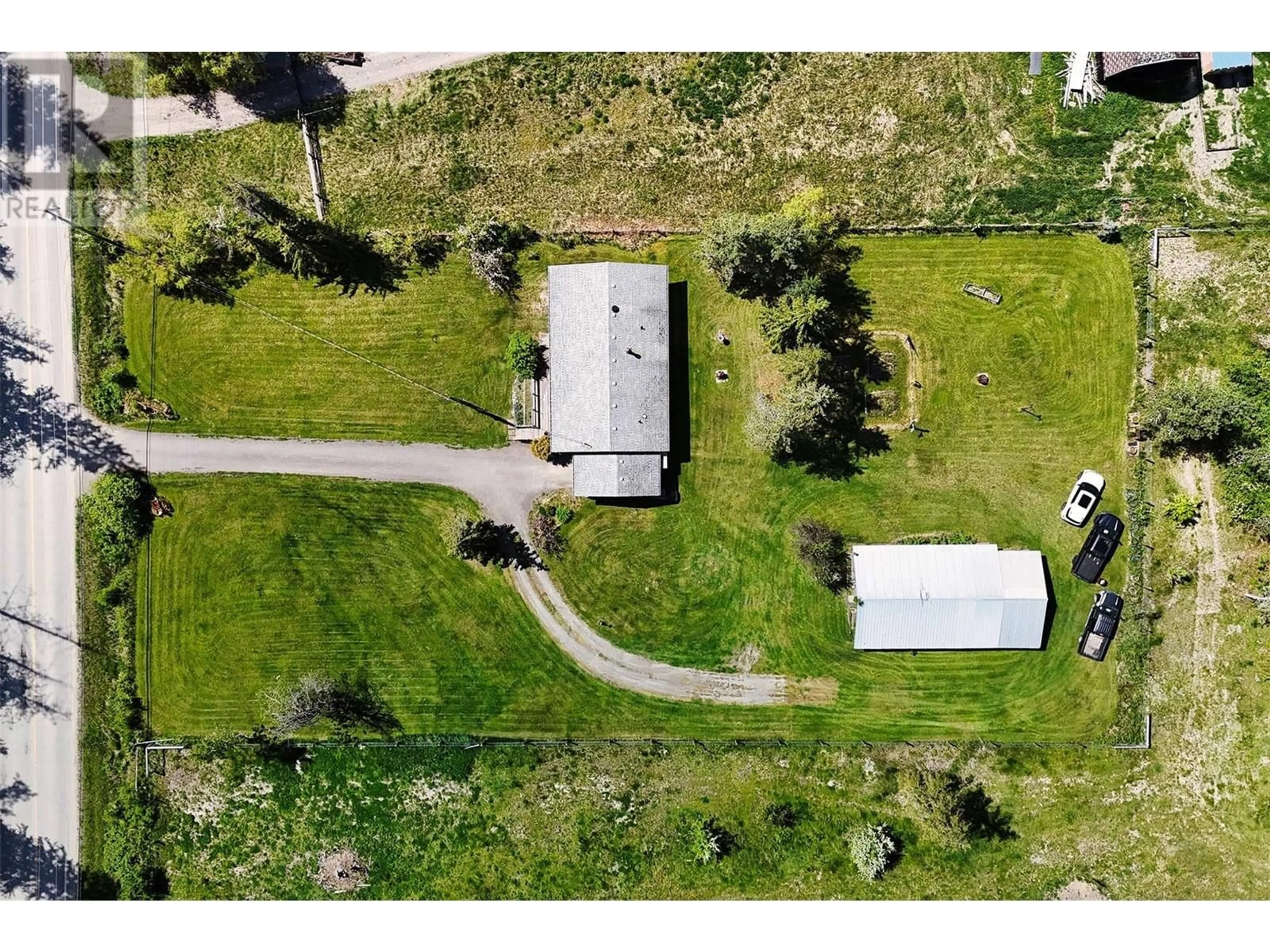 A pic from outside/outdoor area/front of a property/back of a property/a pic from drone, street for 4619 EAGLE BAY ROAD, Eagle Bay British Columbia V0E1T0