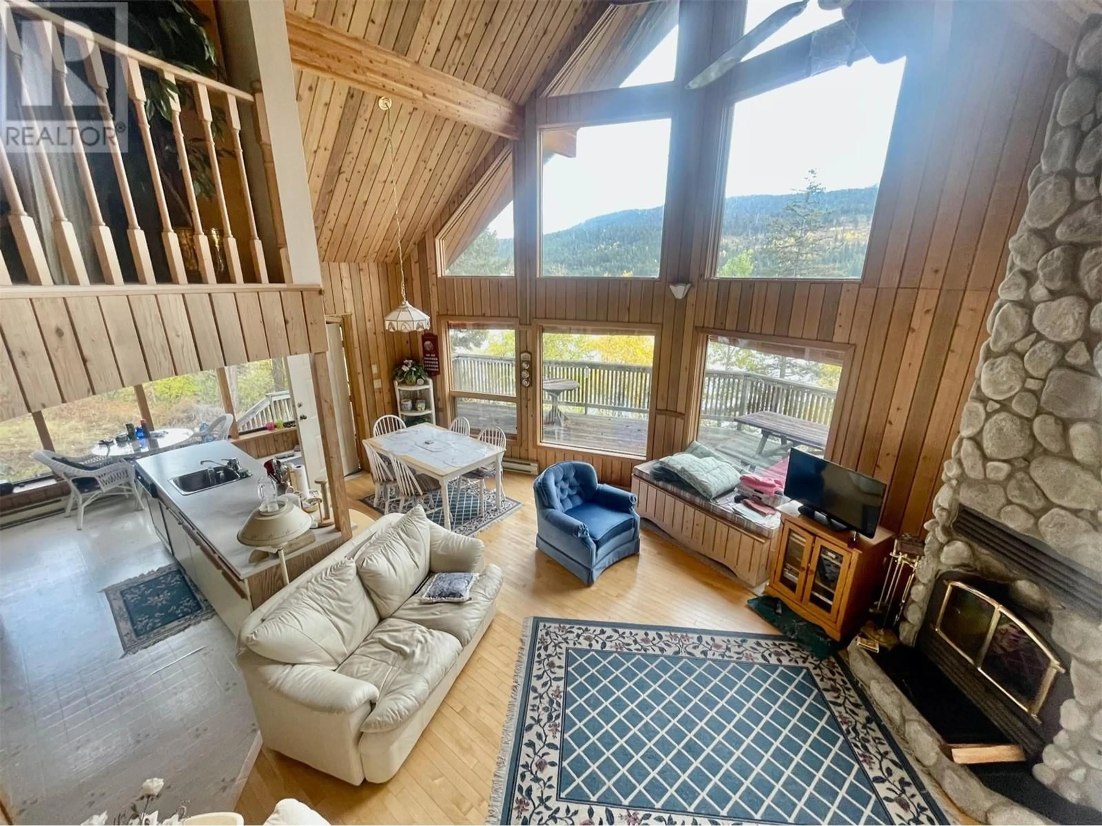 Living room with furniture, wood/laminate floor for 8200 GUN LAKE WEST ROAD, Gold Bridge British Columbia V0K1P0