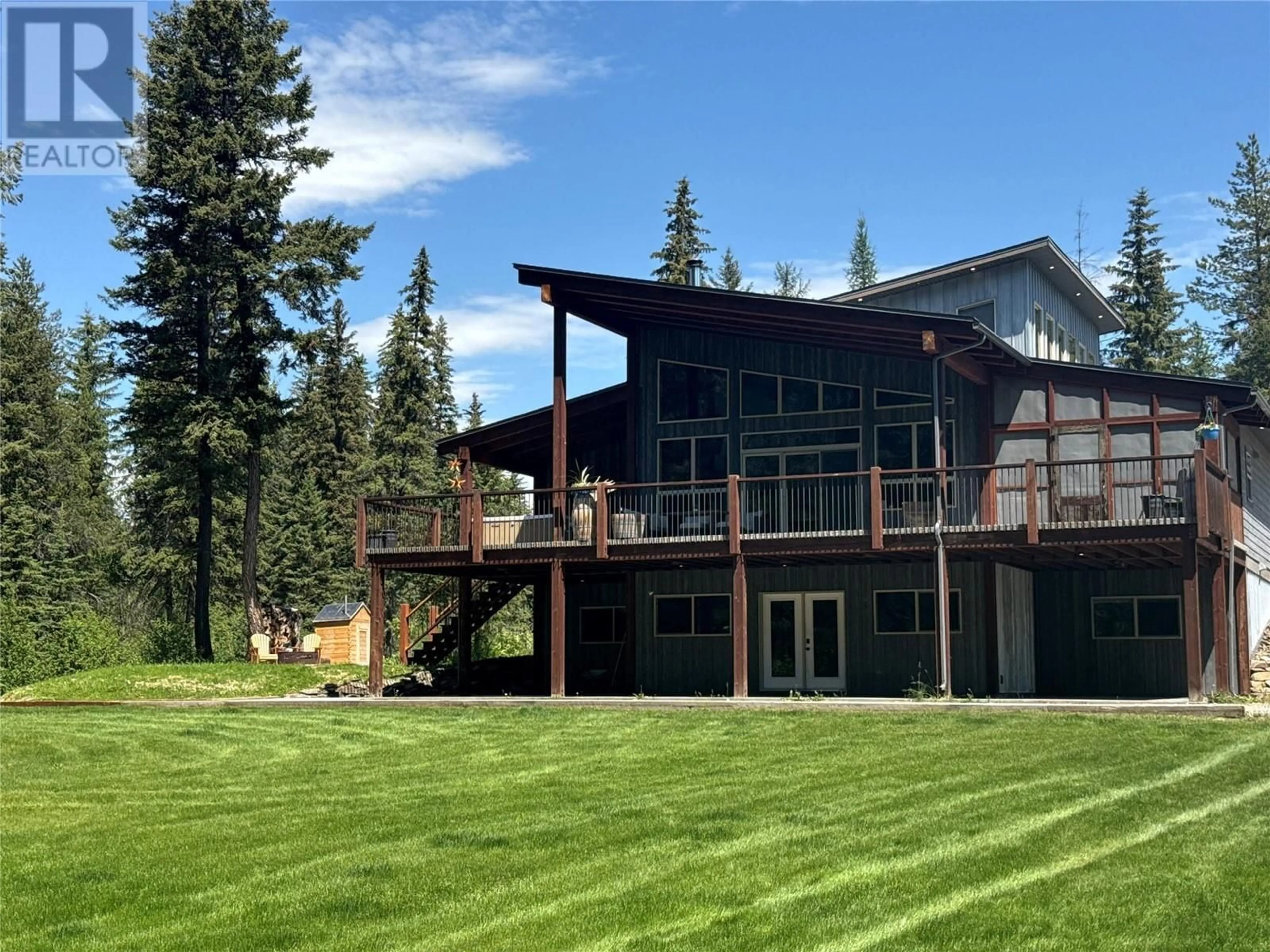 A pic from outside/outdoor area/front of a property/back of a property/a pic from drone, mountain view for 7717 JAFFRAY-BAYNES LAKE RD ROAD, Jaffray British Columbia V0B1T0