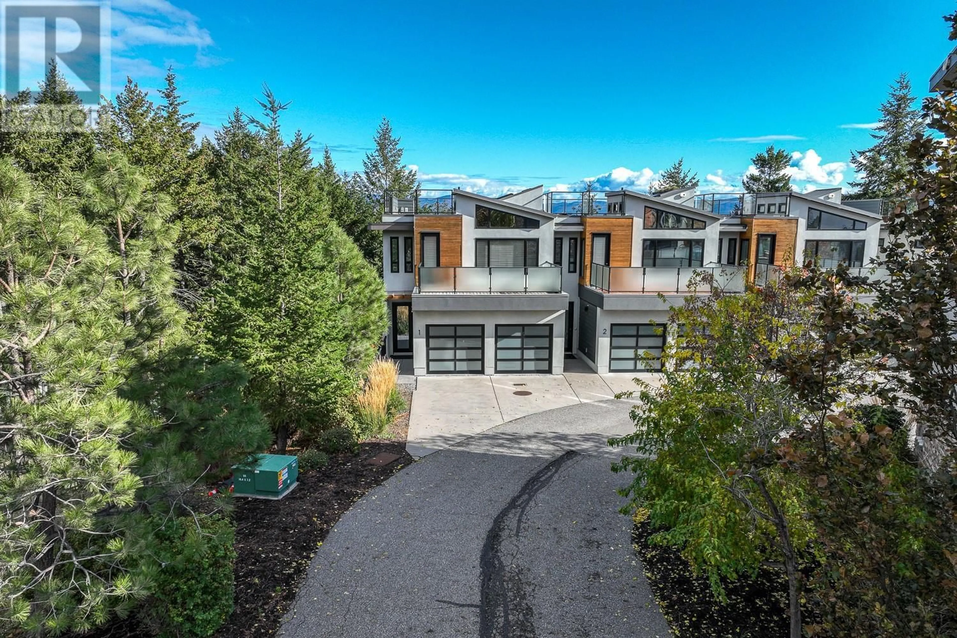 A pic from outside/outdoor area/front of a property/back of a property/a pic from drone, mountain view for 1 - 1818 PEAK POINT COURT, West Kelowna British Columbia V1Z4B4