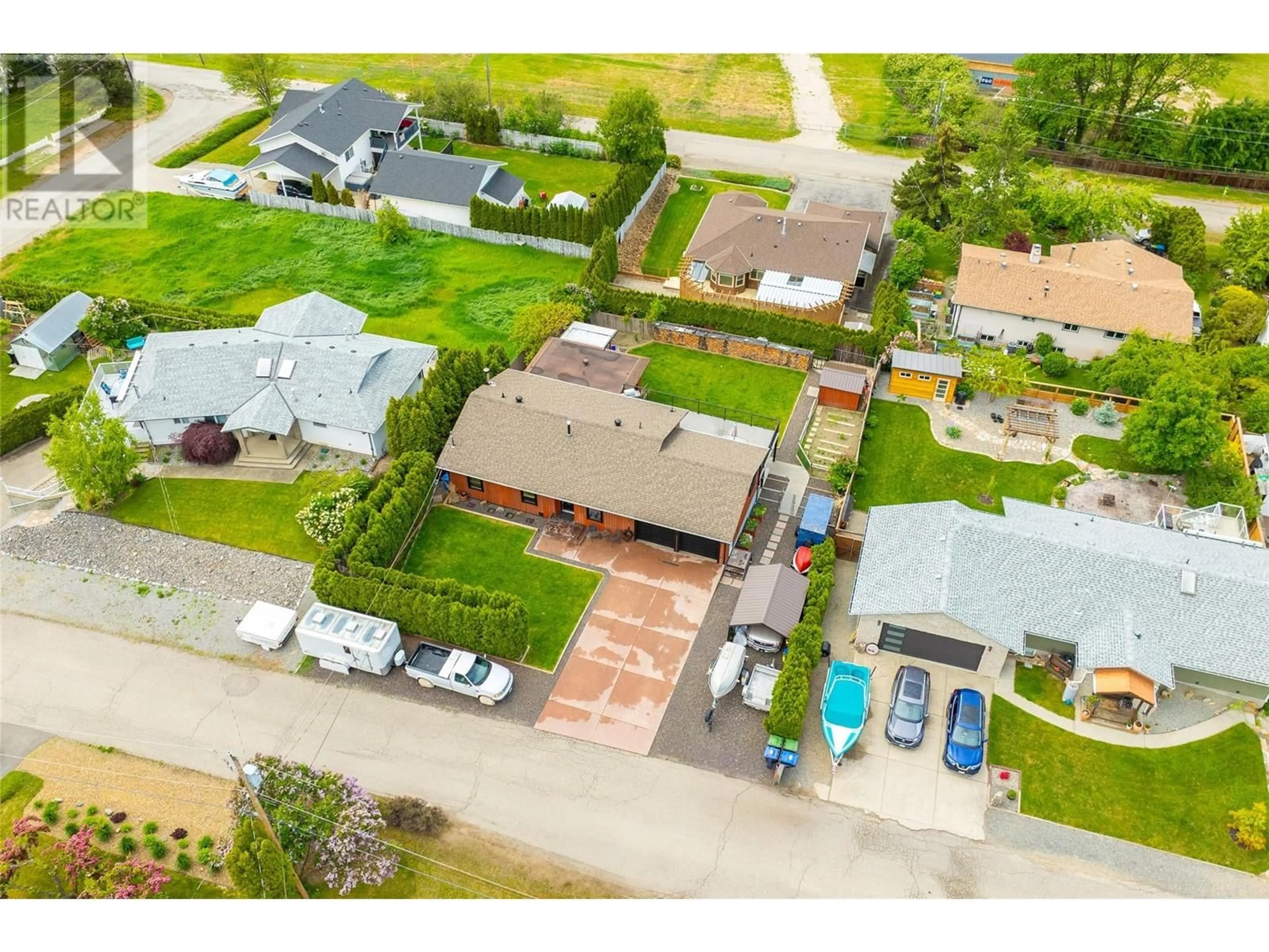 A pic from outside/outdoor area/front of a property/back of a property/a pic from drone, street for 15650 ROBERTS ROAD, Oyama British Columbia V4V2E3