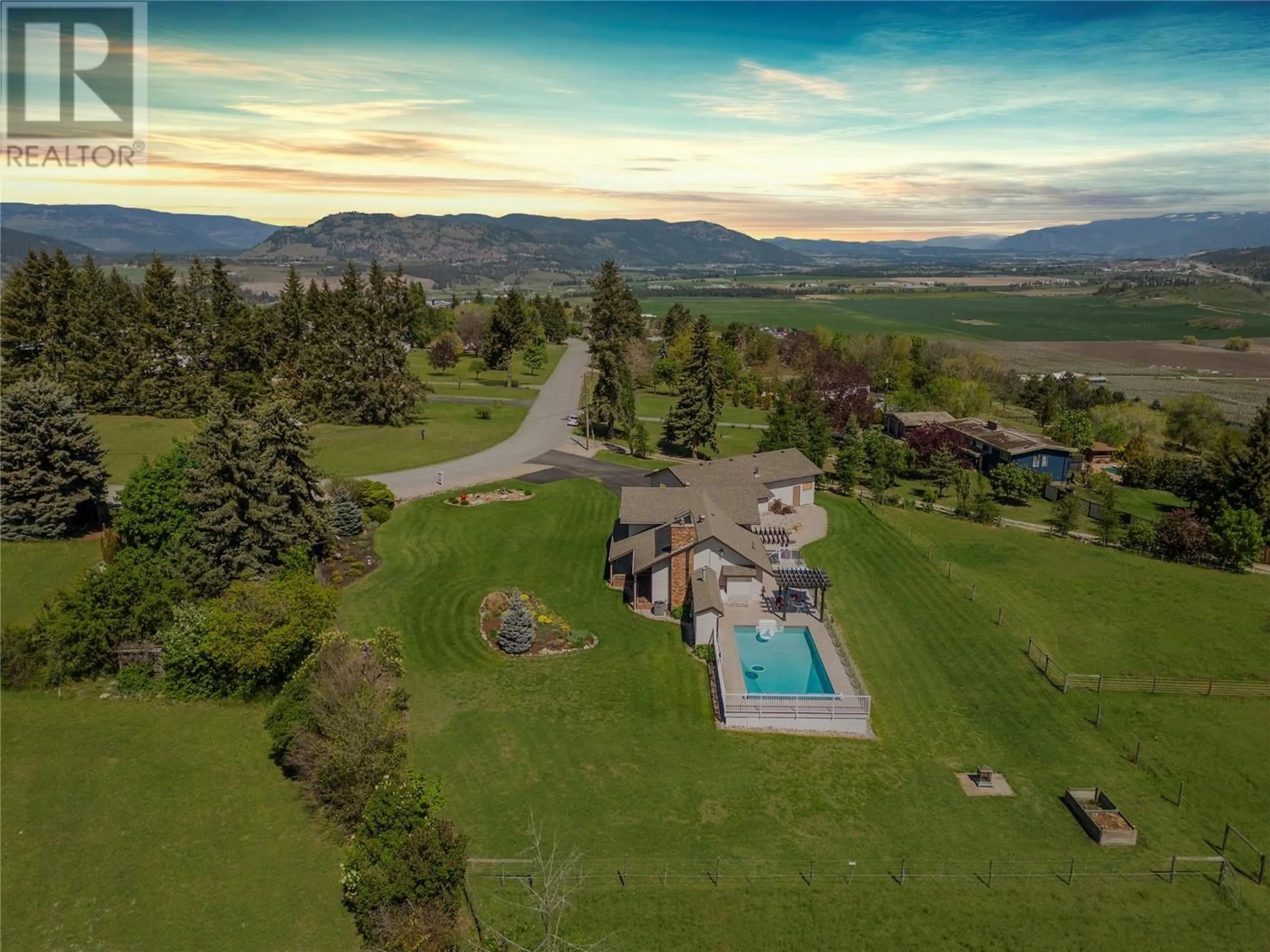 A pic from outside/outdoor area/front of a property/back of a property/a pic from drone, mountain view for 186 STEPPING STONES CRESCENT, Spallumcheen British Columbia V1H1X2