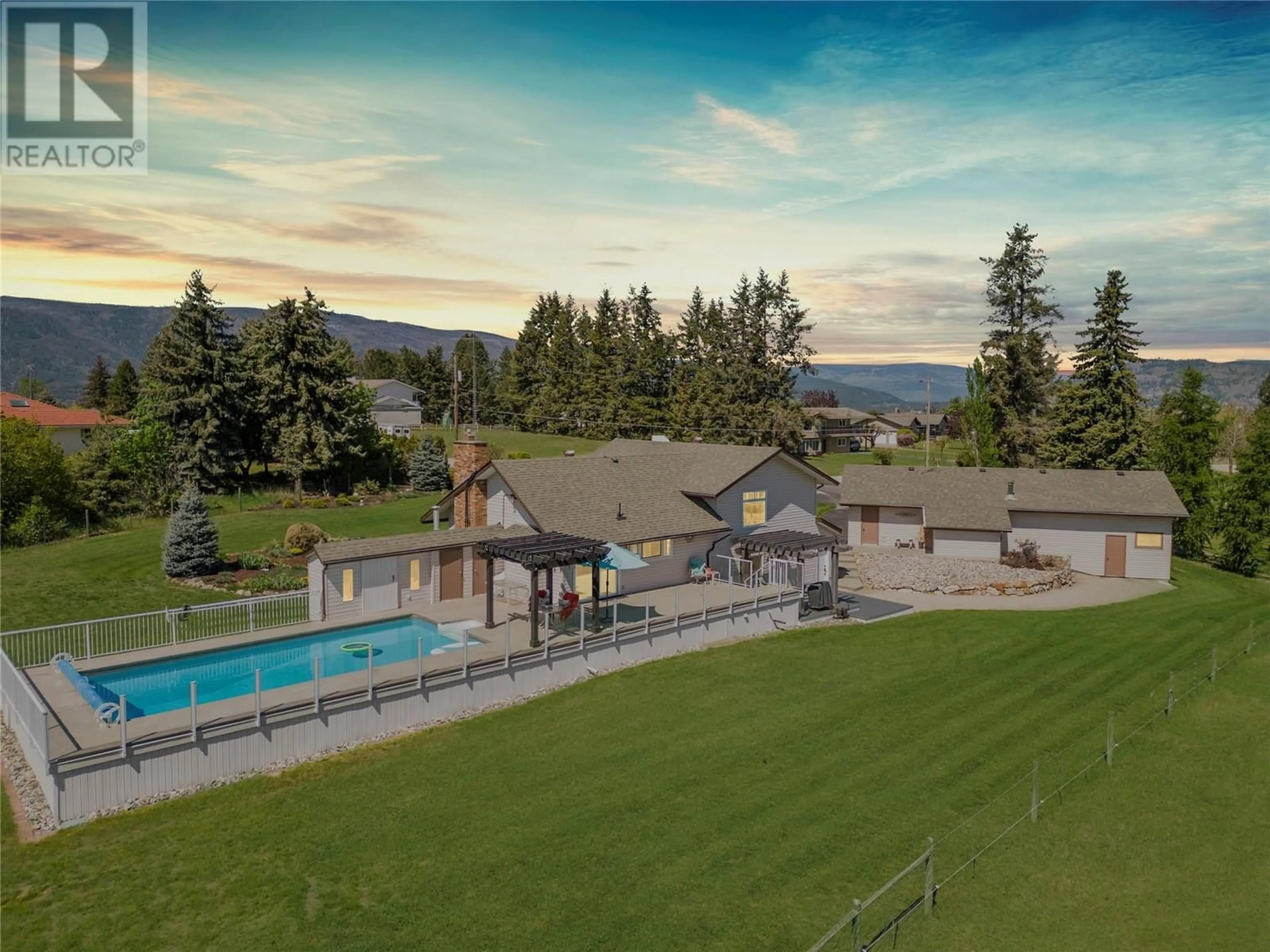 A pic from outside/outdoor area/front of a property/back of a property/a pic from drone, mountain view for 186 STEPPING STONES CRESCENT, Spallumcheen British Columbia V1H1X2