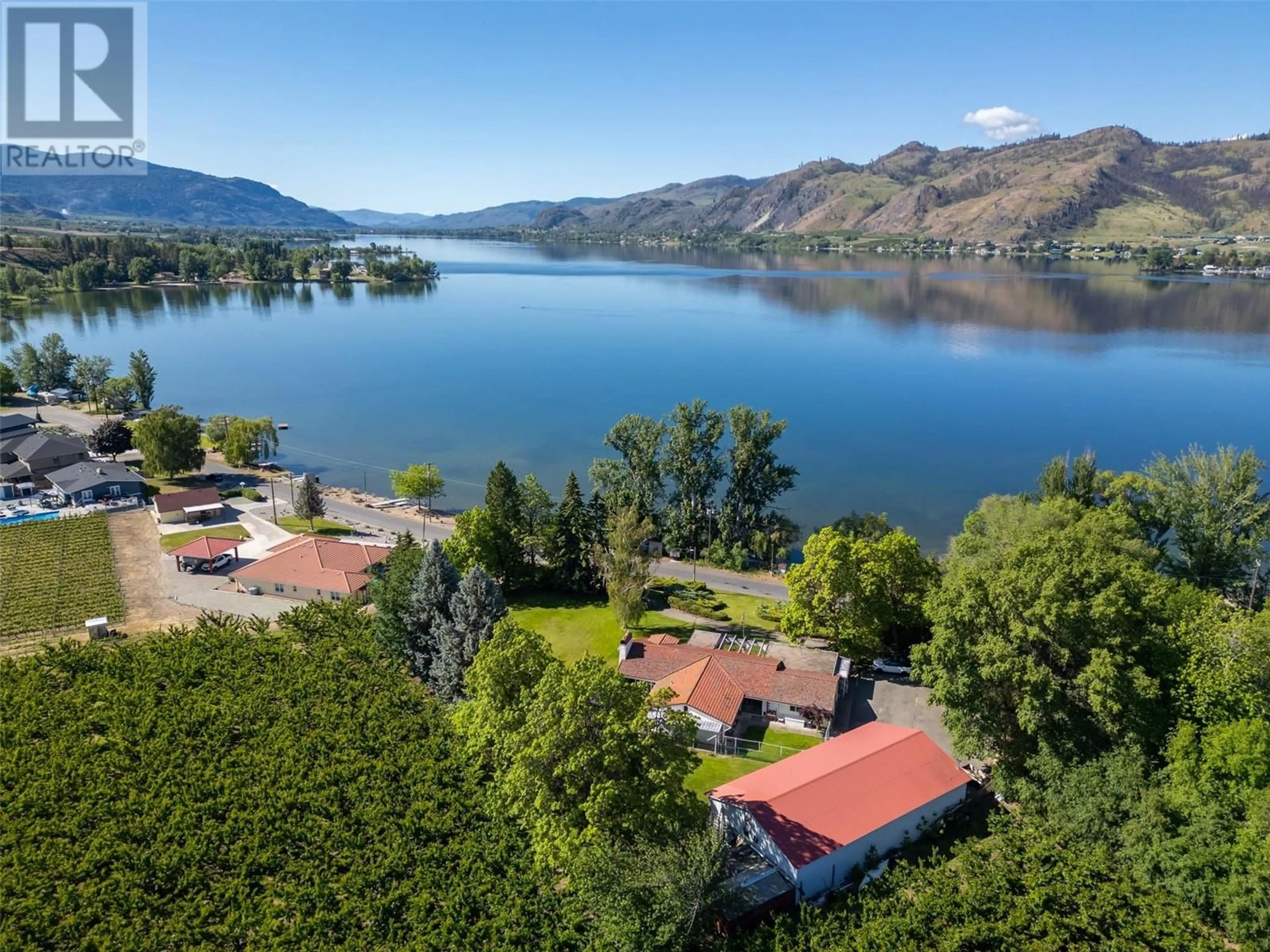 A pic from outside/outdoor area/front of a property/back of a property/a pic from drone, water/lake/river/ocean view for 1209 LAKESHORE DRIVE, Osoyoos British Columbia V0H1V6