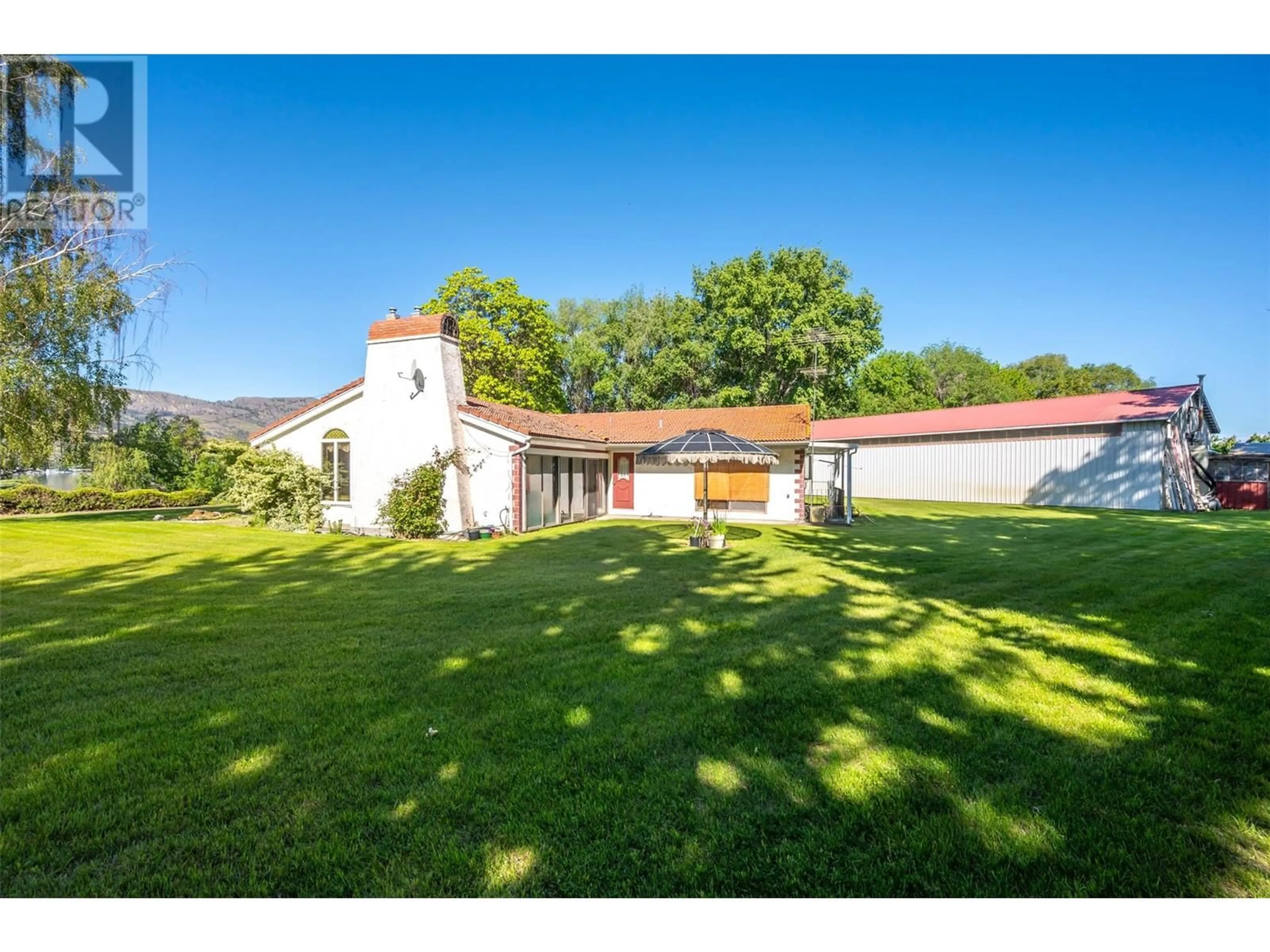 A pic from outside/outdoor area/front of a property/back of a property/a pic from drone, building for 1209 LAKESHORE DRIVE, Osoyoos British Columbia V0H1V6