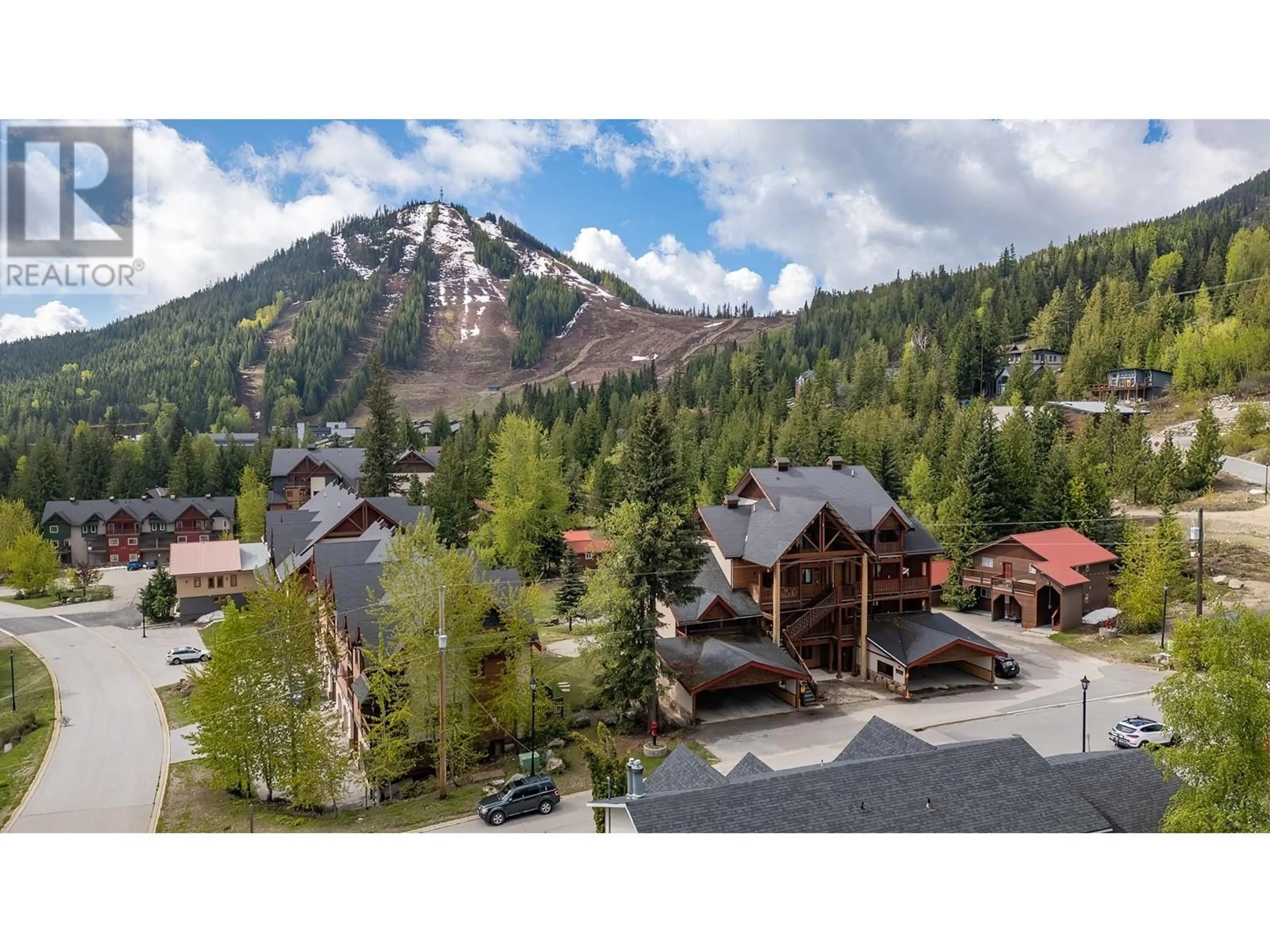 A pic from outside/outdoor area/front of a property/back of a property/a pic from drone, mountain view for 1A - 1080 OLAUS WAY, Rossland British Columbia V0G1Y0