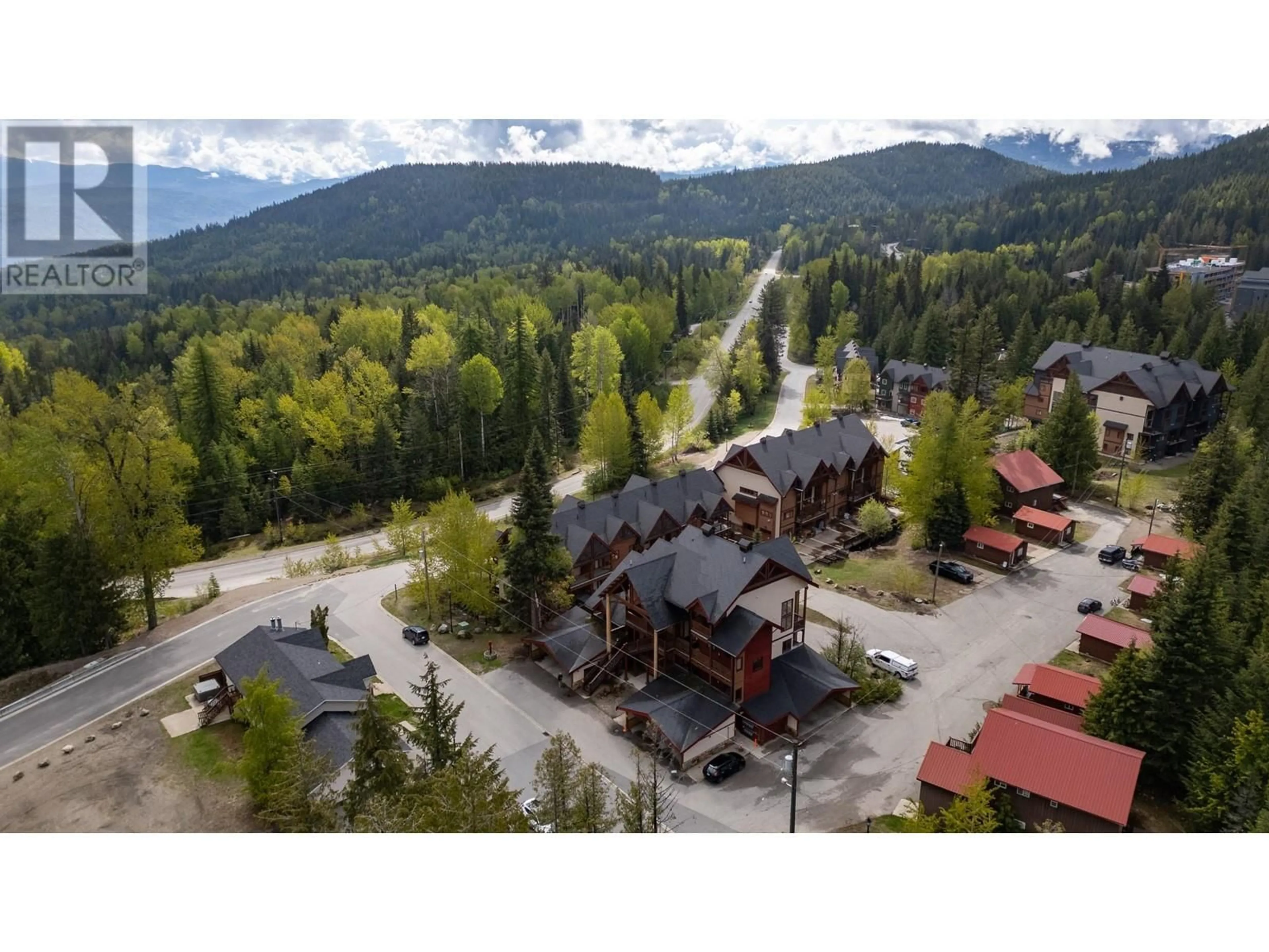 A pic from outside/outdoor area/front of a property/back of a property/a pic from drone, mountain view for 1A - 1080 OLAUS WAY, Rossland British Columbia V0G1Y0