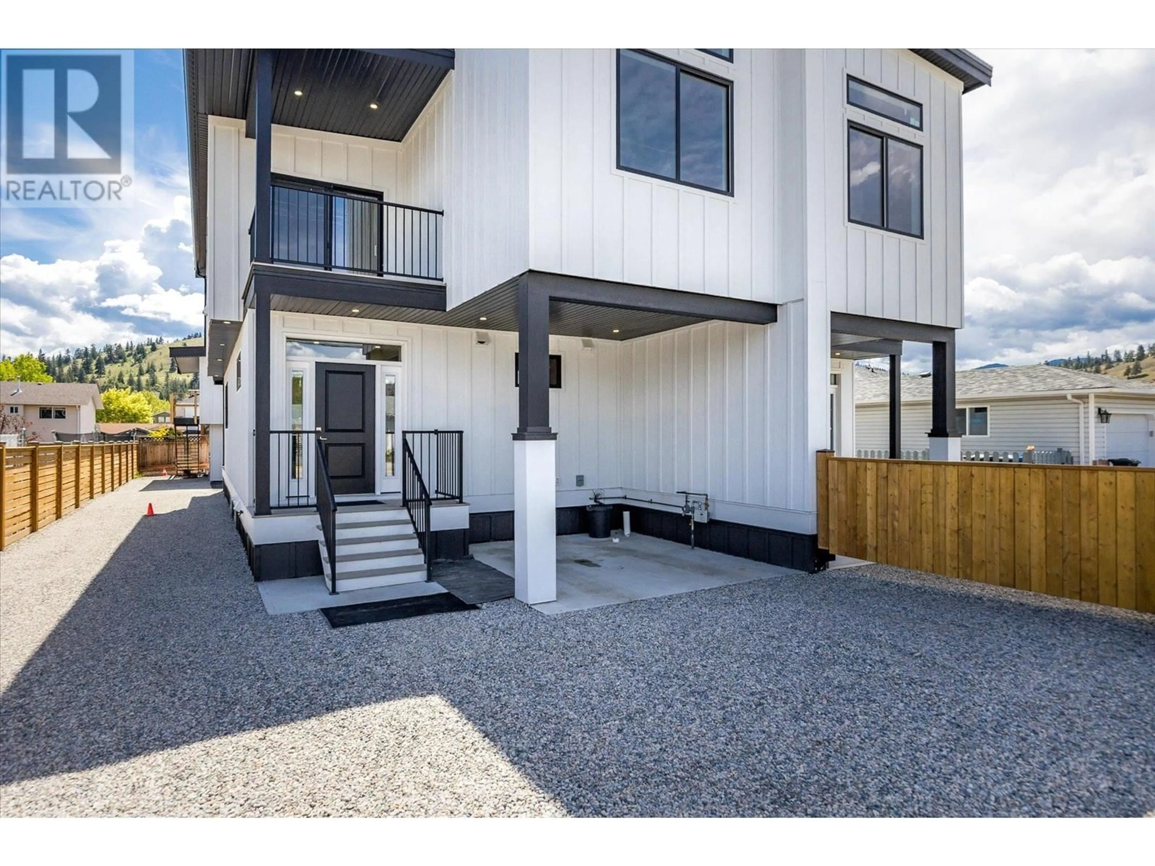 Home with vinyl exterior material, street for 1 - 10907 PRAIRIE VALLEY ROAD, Summerland British Columbia V0H1Z8