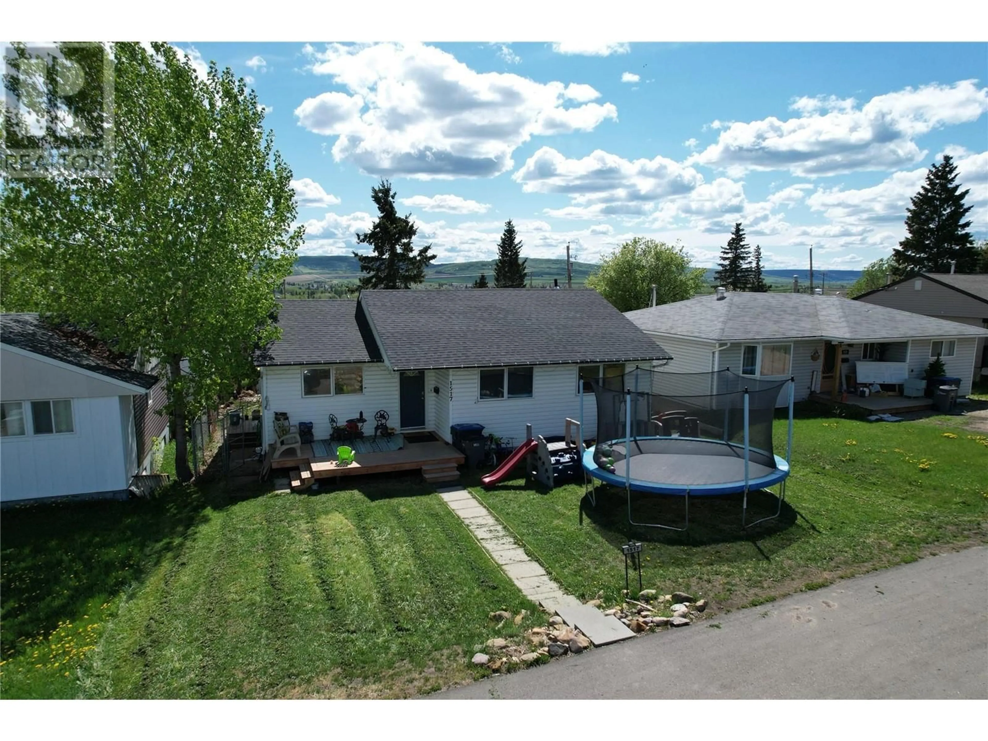 A pic from outside/outdoor area/front of a property/back of a property/a pic from drone, mountain view for 1517 95 AVENUE, Dawson Creek British Columbia V1G1J9